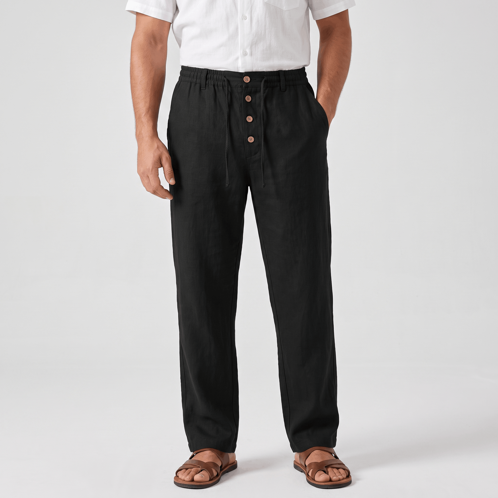 Men's black linen drawstring pants with a relaxed straight-leg fit, elastic waistband, and side pockets.