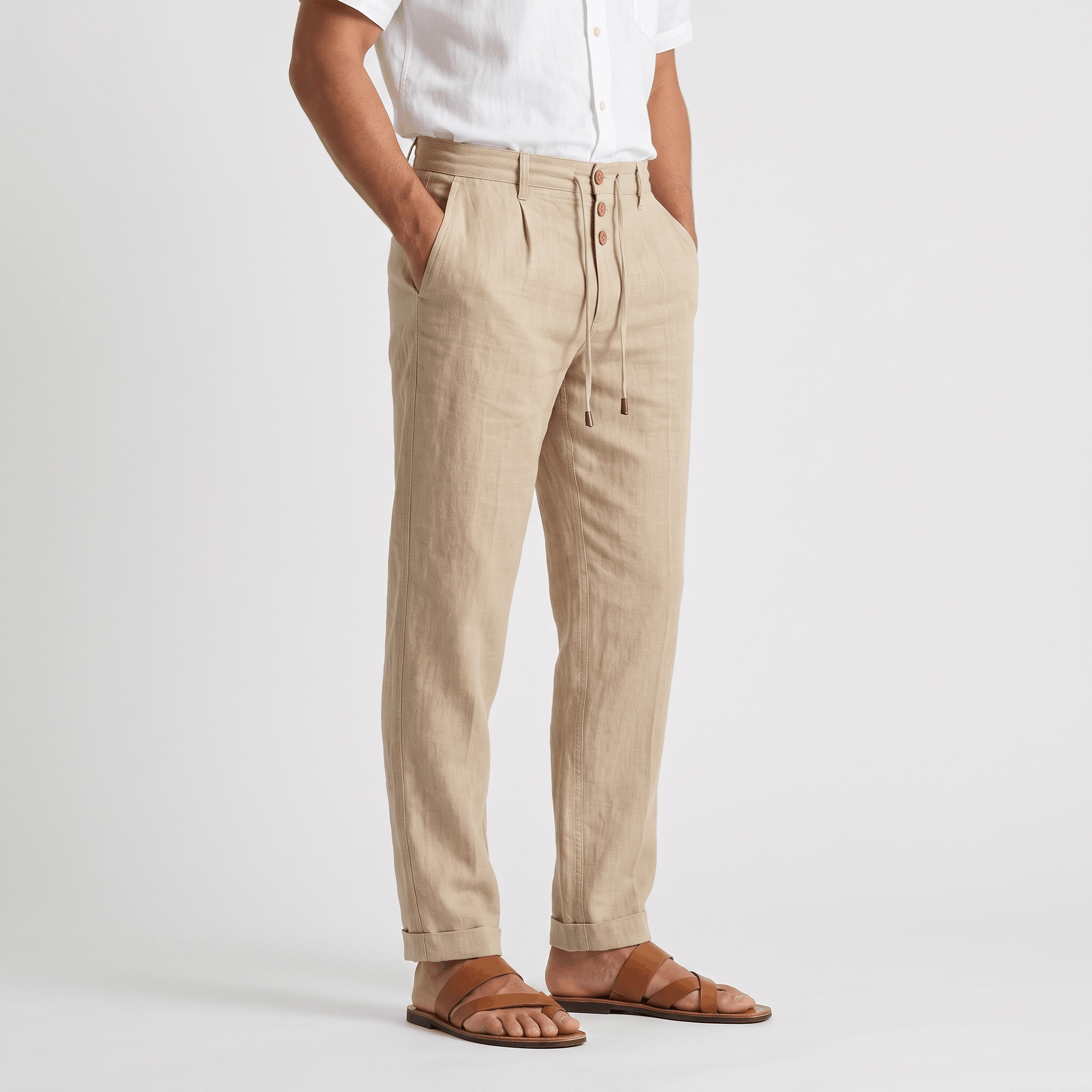 Side view of men's beige linen drawstring pants featuring a relaxed fit, straight-leg silhouette, and breathable linen fabric.