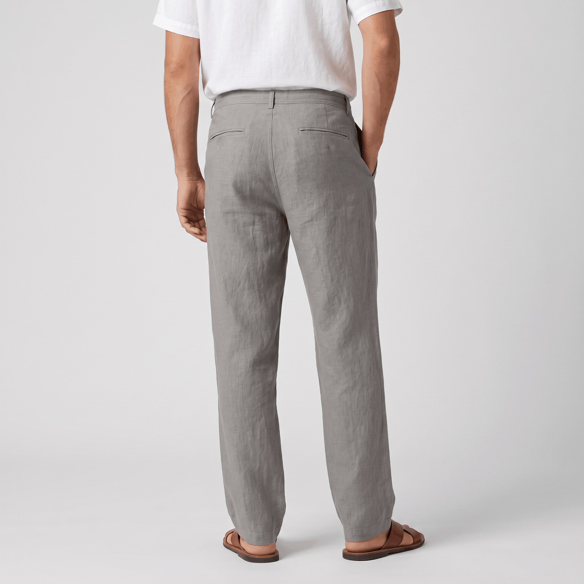 Back view of men's gray linen drawstring pants with an elastic waistband and classic straight-leg fit.