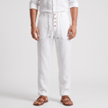 Men's white linen drawstring pants with a relaxed straight-leg fit, button-front detail, elastic waistband, and side pockets.