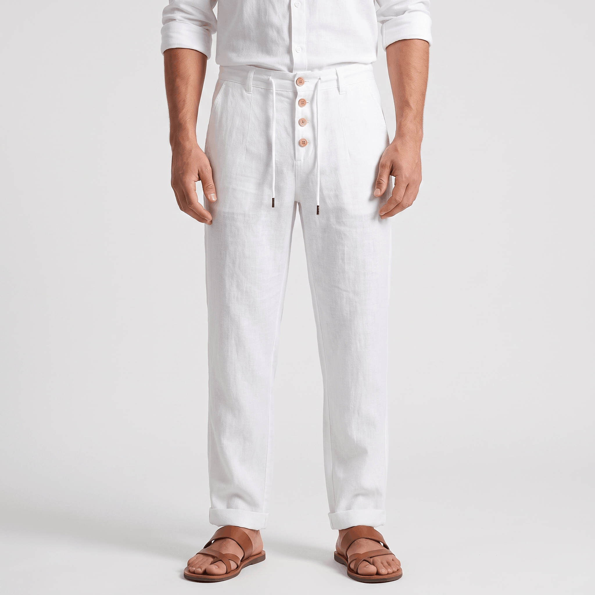 Men's white linen drawstring pants with a relaxed straight-leg fit, button-front detail, elastic waistband, and side pockets.
