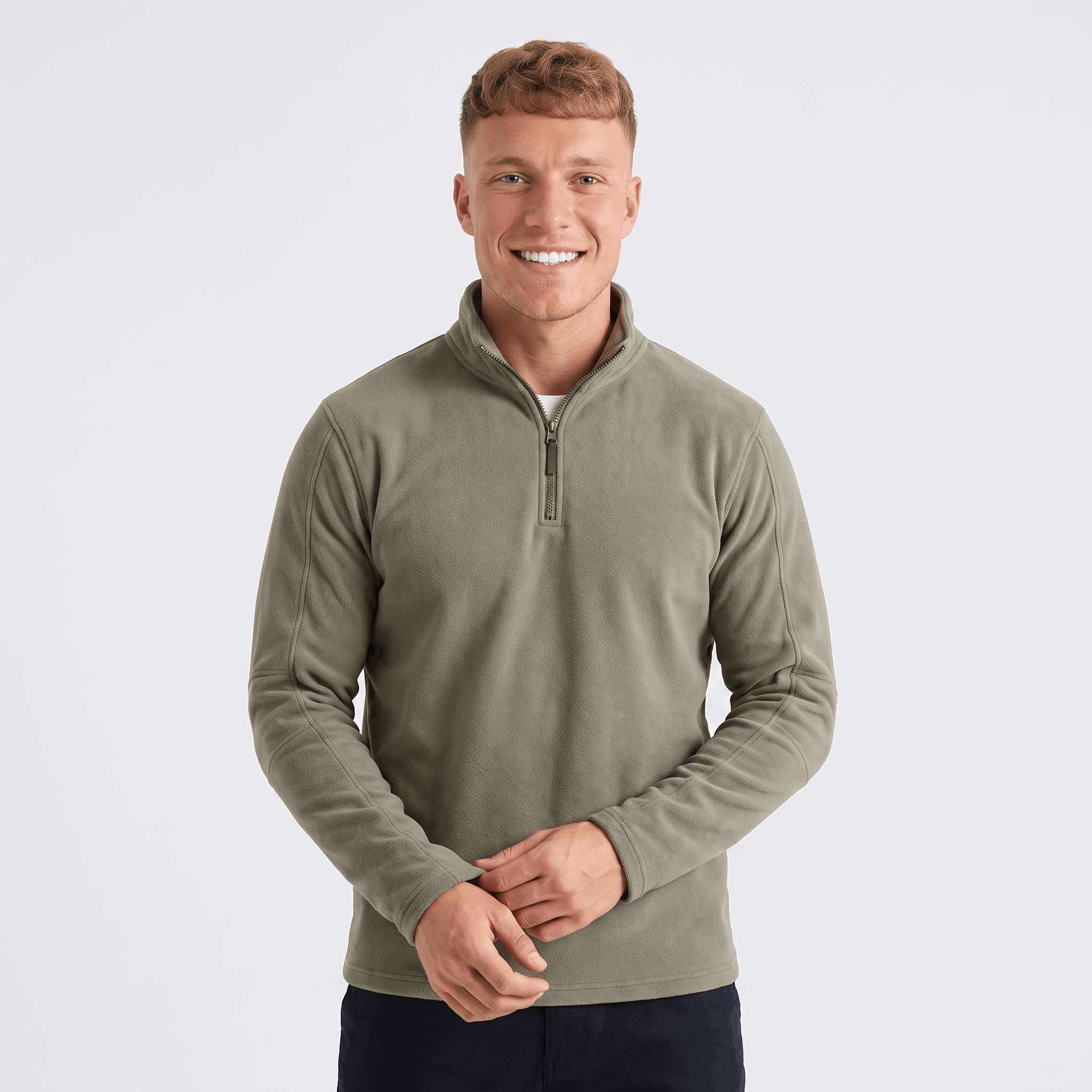 Man wearing an olive green quarter-zip knit sweater with a stand collar, long sleeves, and a modern classic fit.