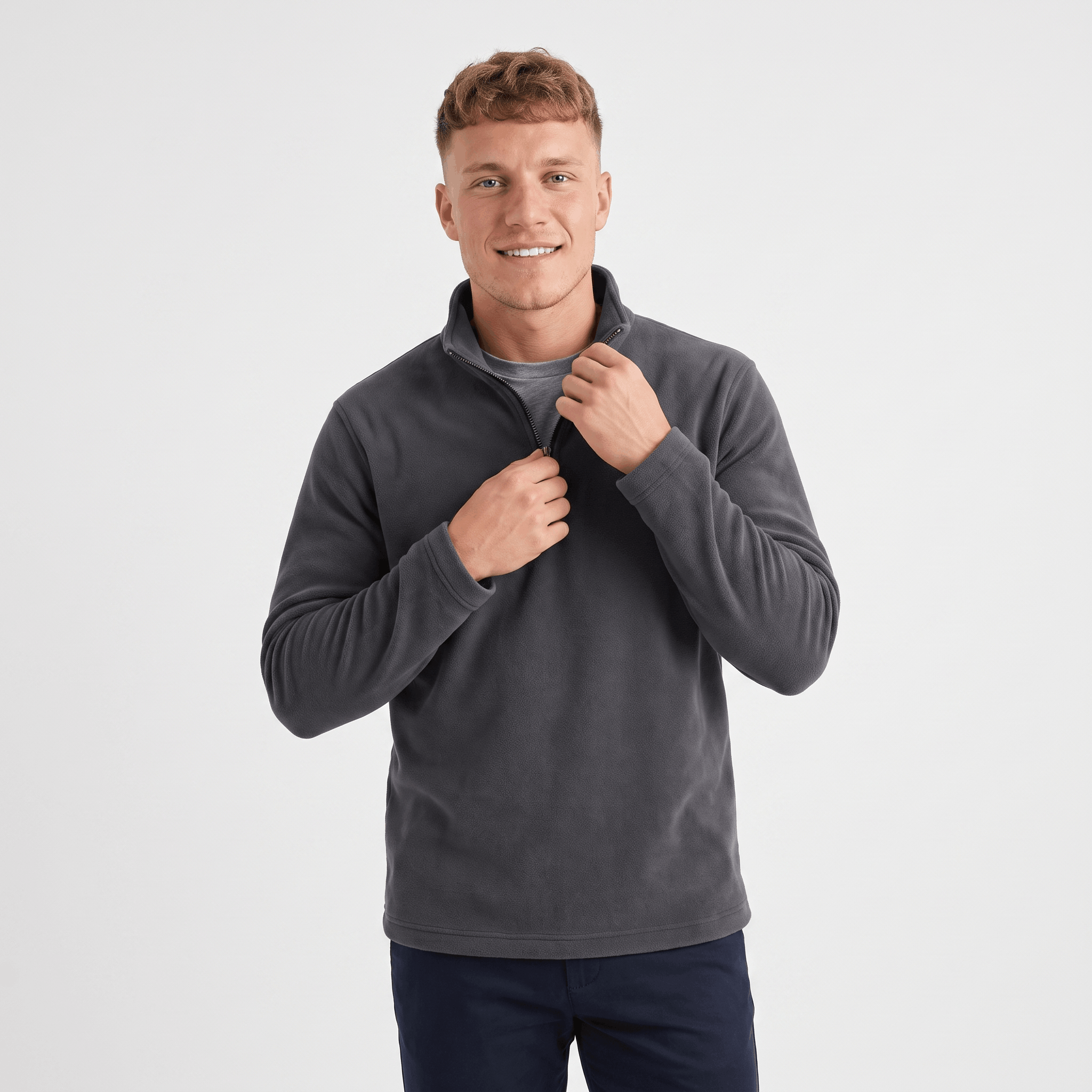 Man wearing a charcoal gray quarter-zip knit sweater featuring a stand collar, long sleeves, and a comfortable fit.