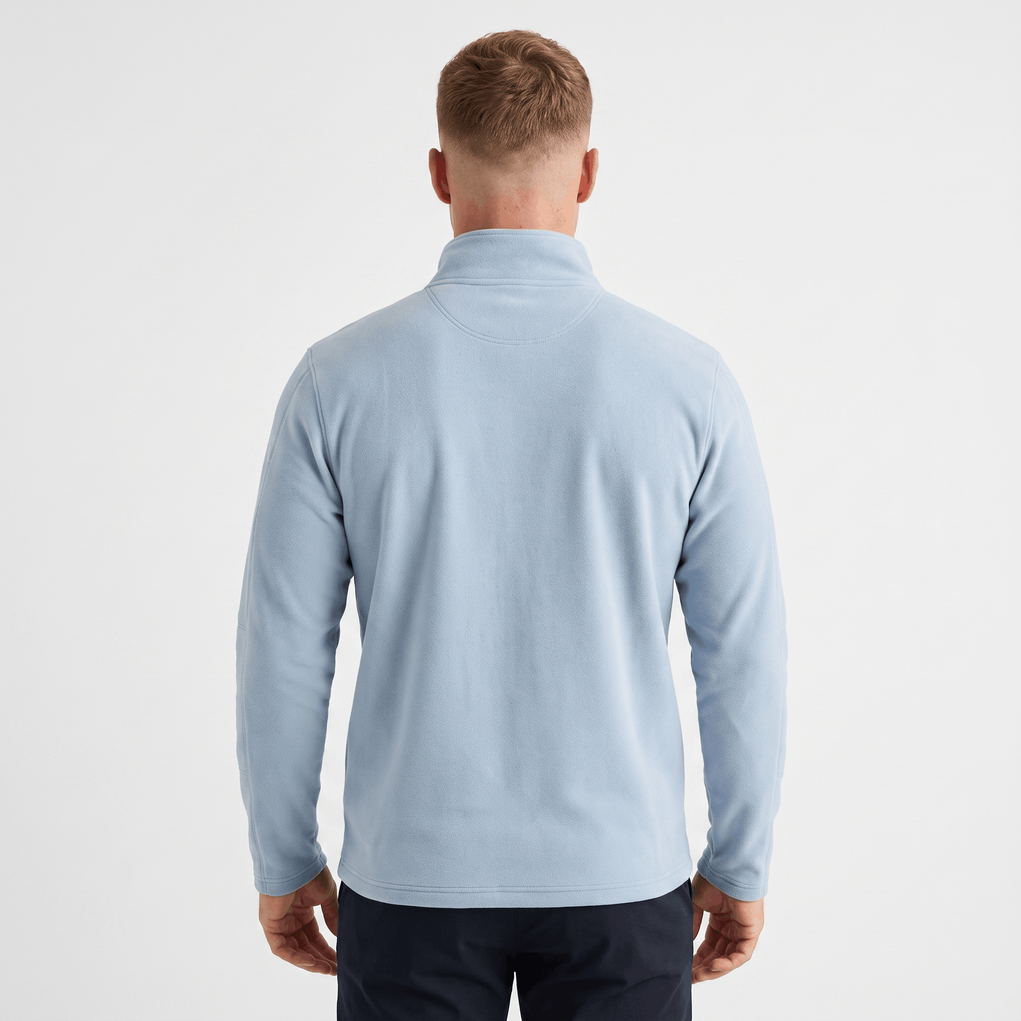 Back view of a men's light blue quarter-zip knit sweater with a stand collar and ribbed cuffs.