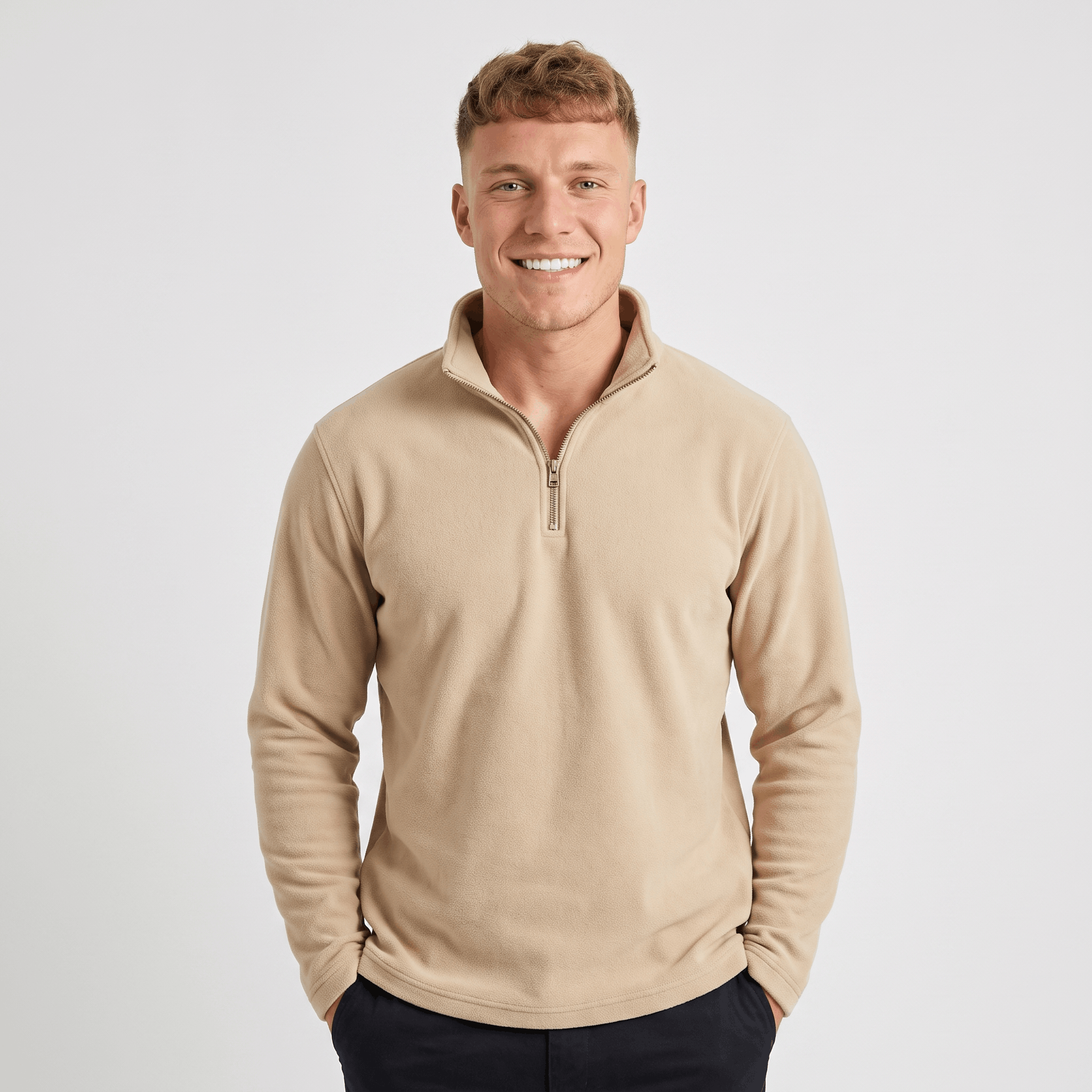 Man wearing a beige quarter-zip knit sweater with a stand collar, long sleeves, and a relaxed fit.