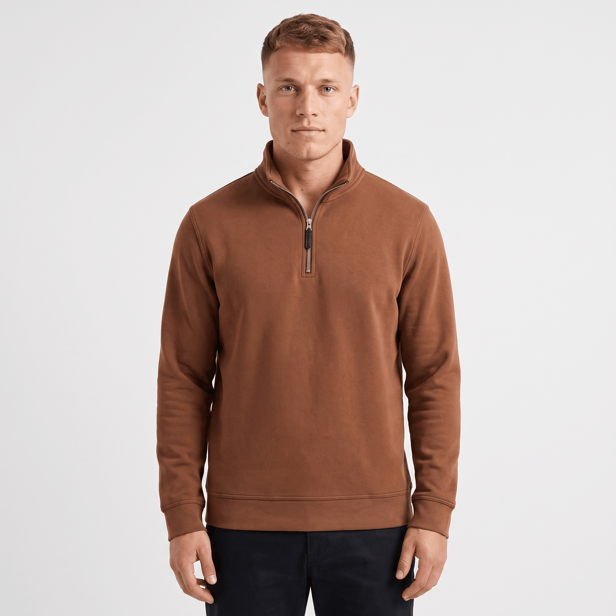Man wearing a brown quarter-zip knit sweater with a stand collar, long sleeves, and a modern fit.
