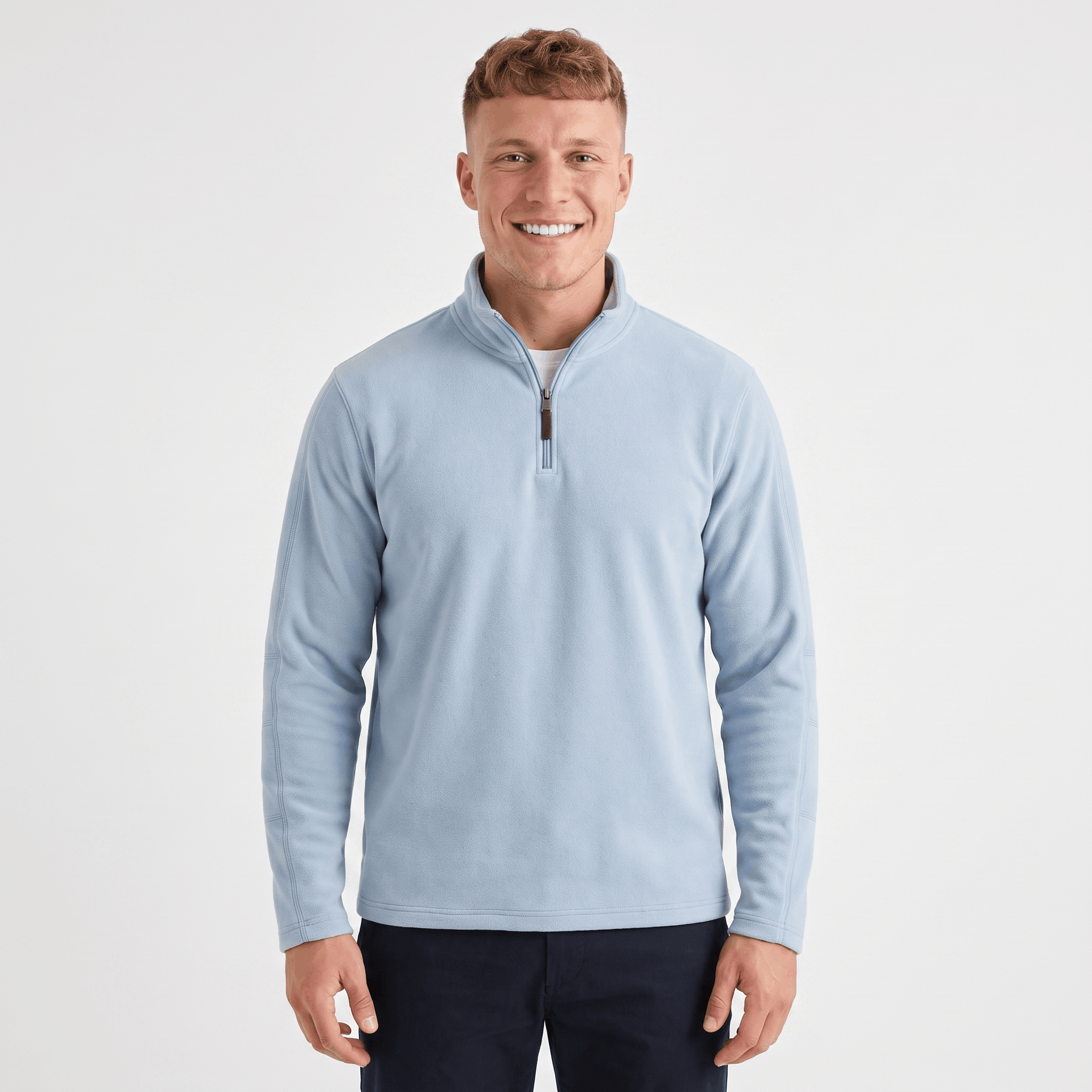 Man wearing a light blue quarter-zip knit sweater with a stand collar, long sleeves, and a classic fit.