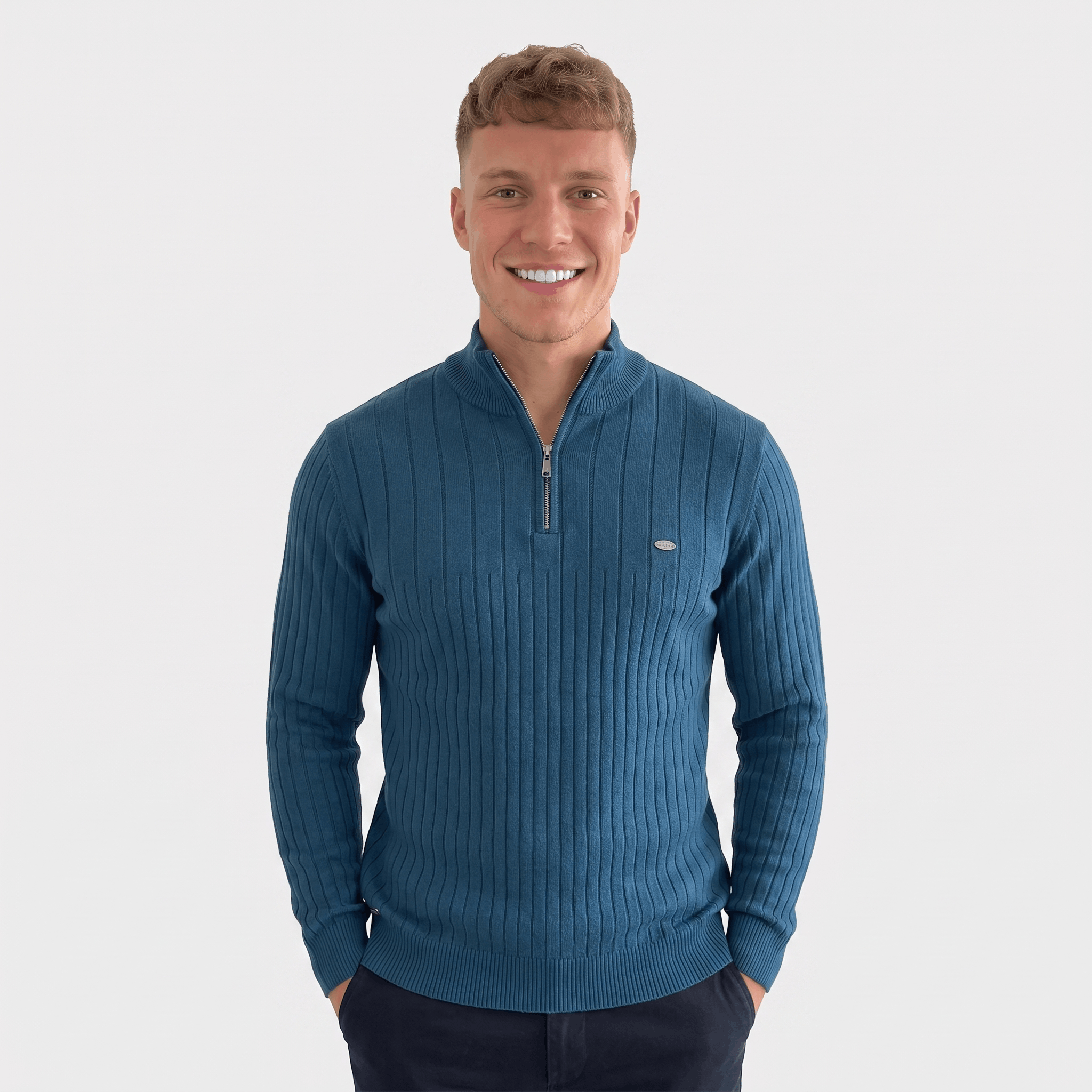 Man wearing a blue ribbed quarter-zip knit sweater with a stand collar, long sleeves, and a modern slim fit.
