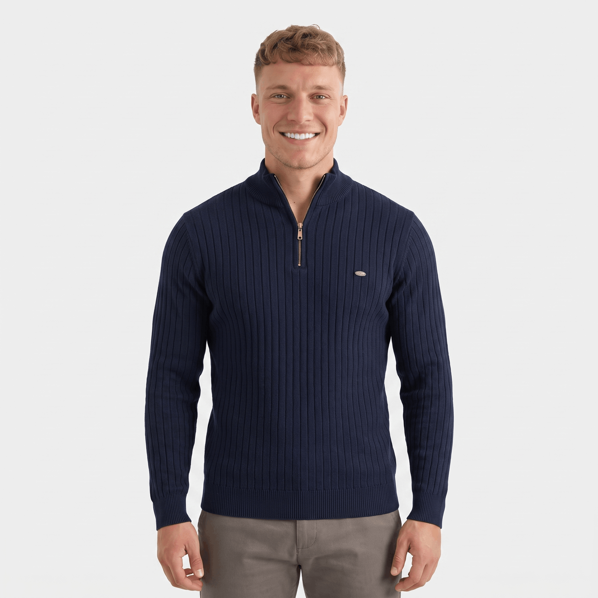 Man wearing a navy ribbed quarter-zip knit sweater featuring a stand collar, long sleeves, and a tailored fit.