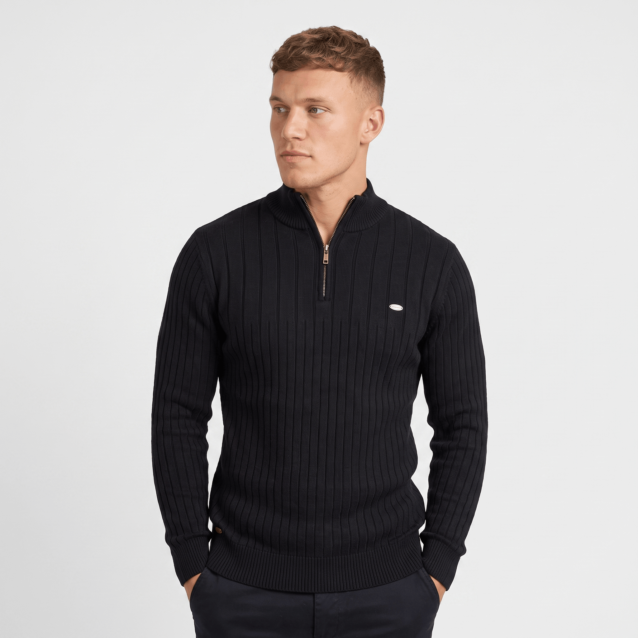 Back view of a men's black ribbed quarter-zip knit sweater with a stand collar and fitted silhouette.