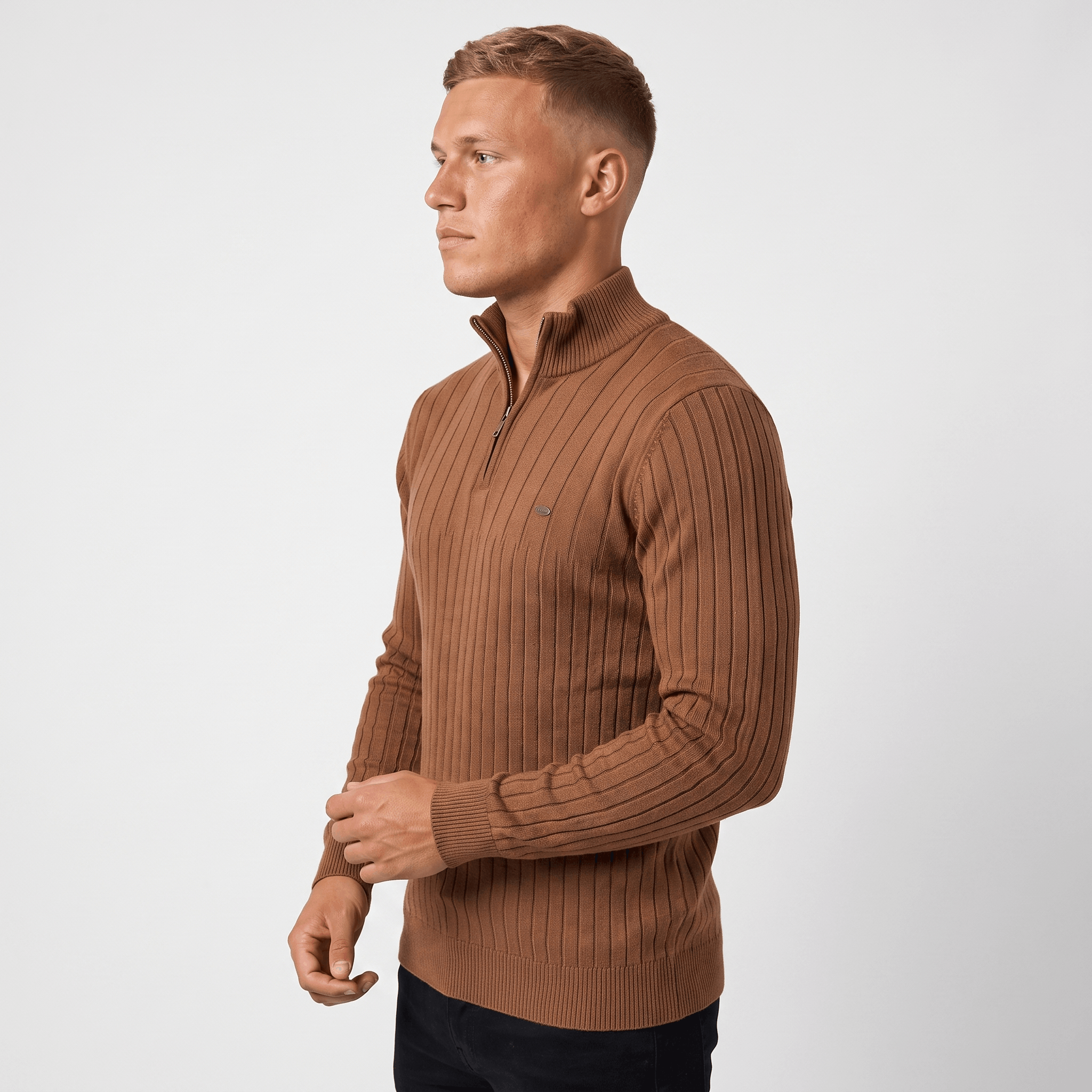 Side view of a man wearing a brown ribbed quarter-zip sweater with a stand collar and classic fit.