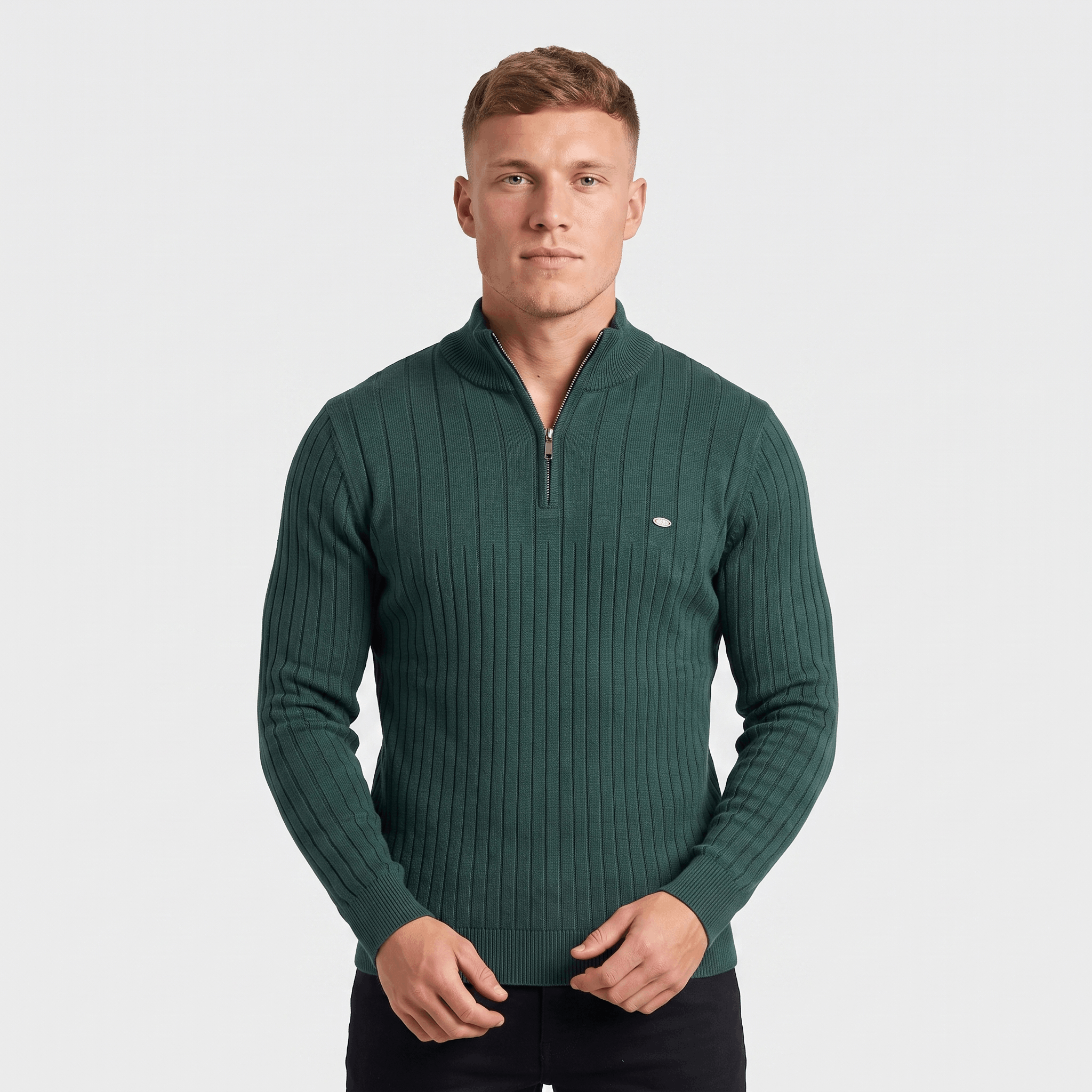 Man wearing a green ribbed quarter-zip knit sweater with a stand collar, long sleeves, and a modern fit.