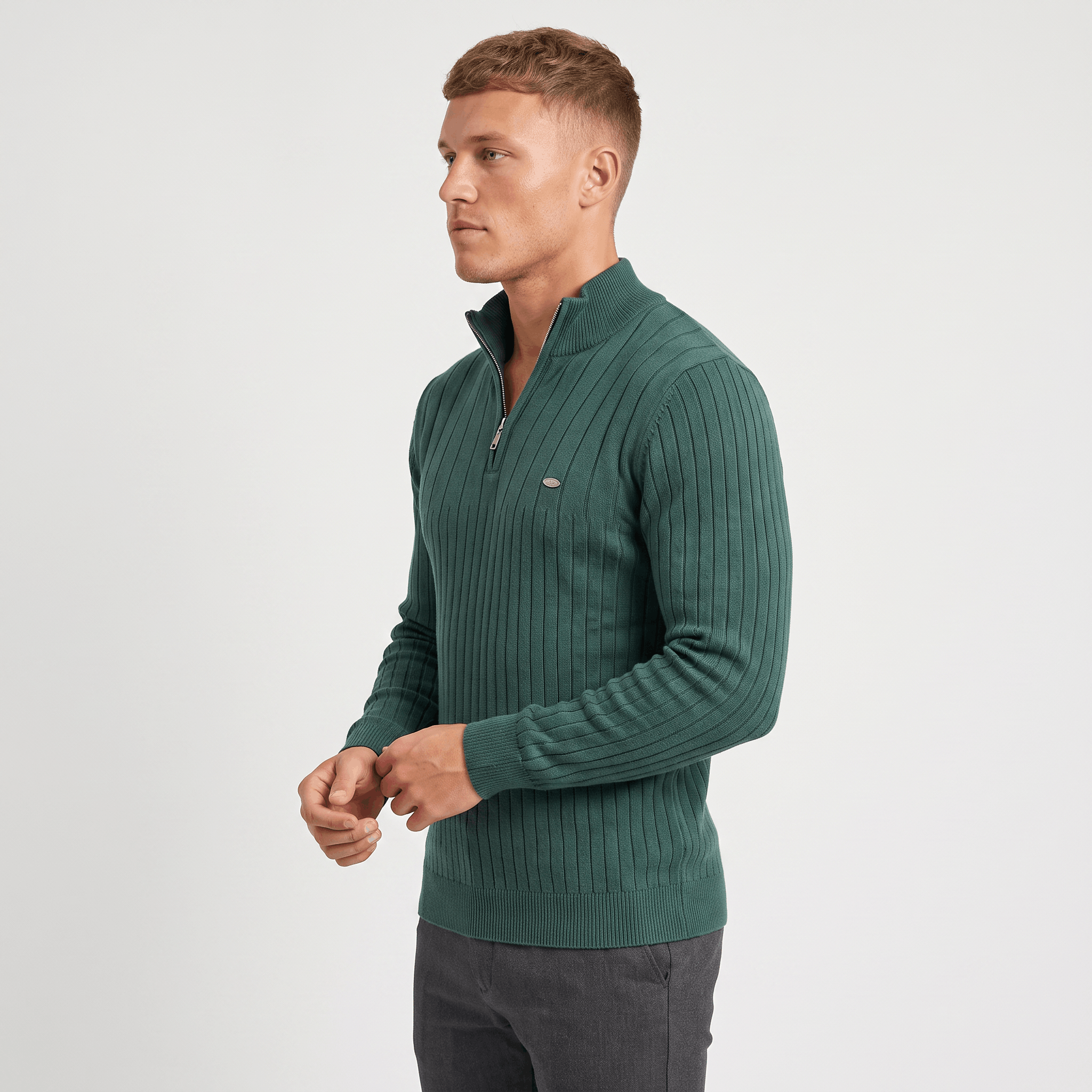 Side view of a man wearing a green ribbed quarter-zip sweater featuring a stand collar and slim silhouette.