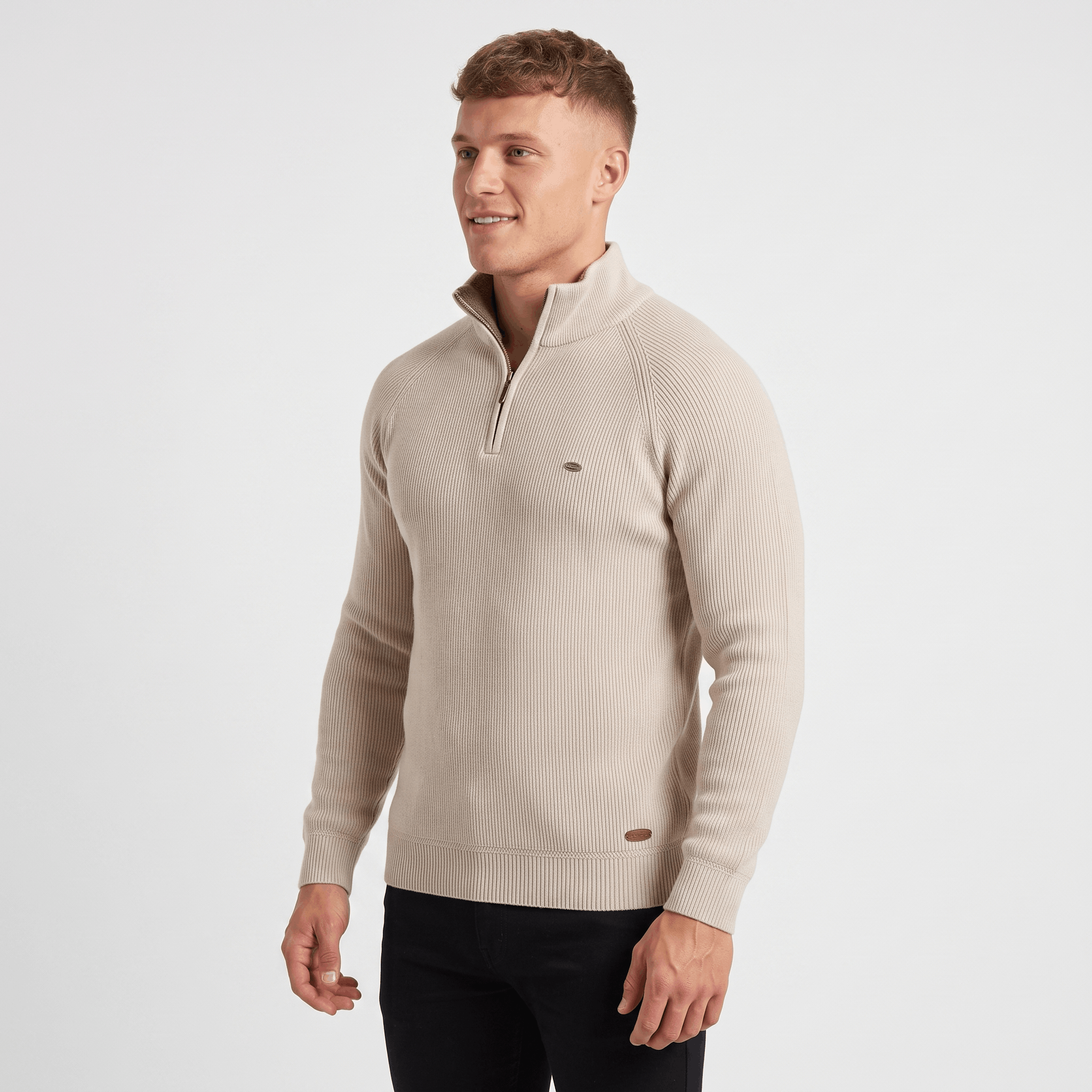 Side view of a man wearing a cream ribbed quarter-zip sweater featuring a stand collar and tailored silhouette.