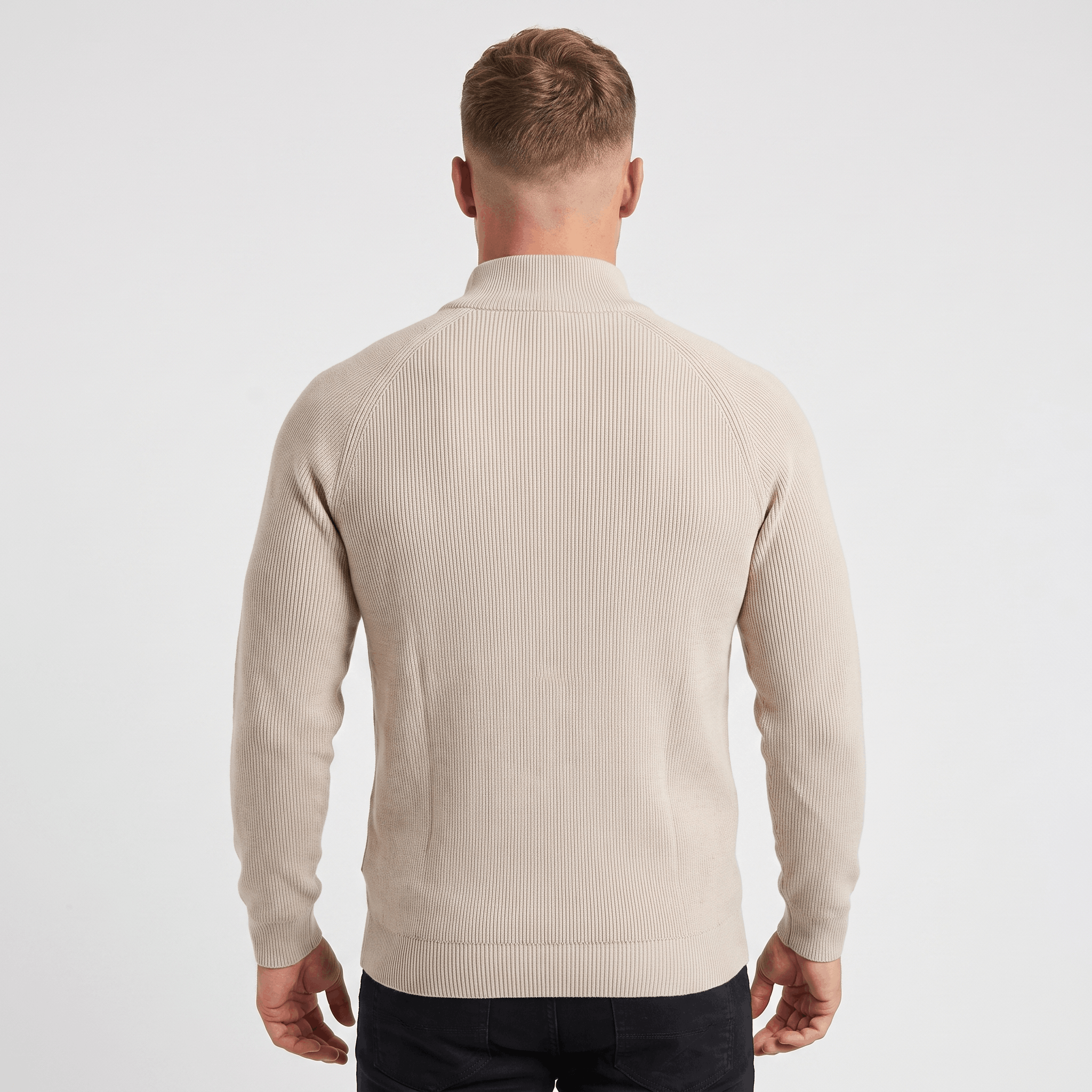 Back view of a men's cream ribbed quarter-zip knit sweater with a stand collar and vertical ribbed texture.