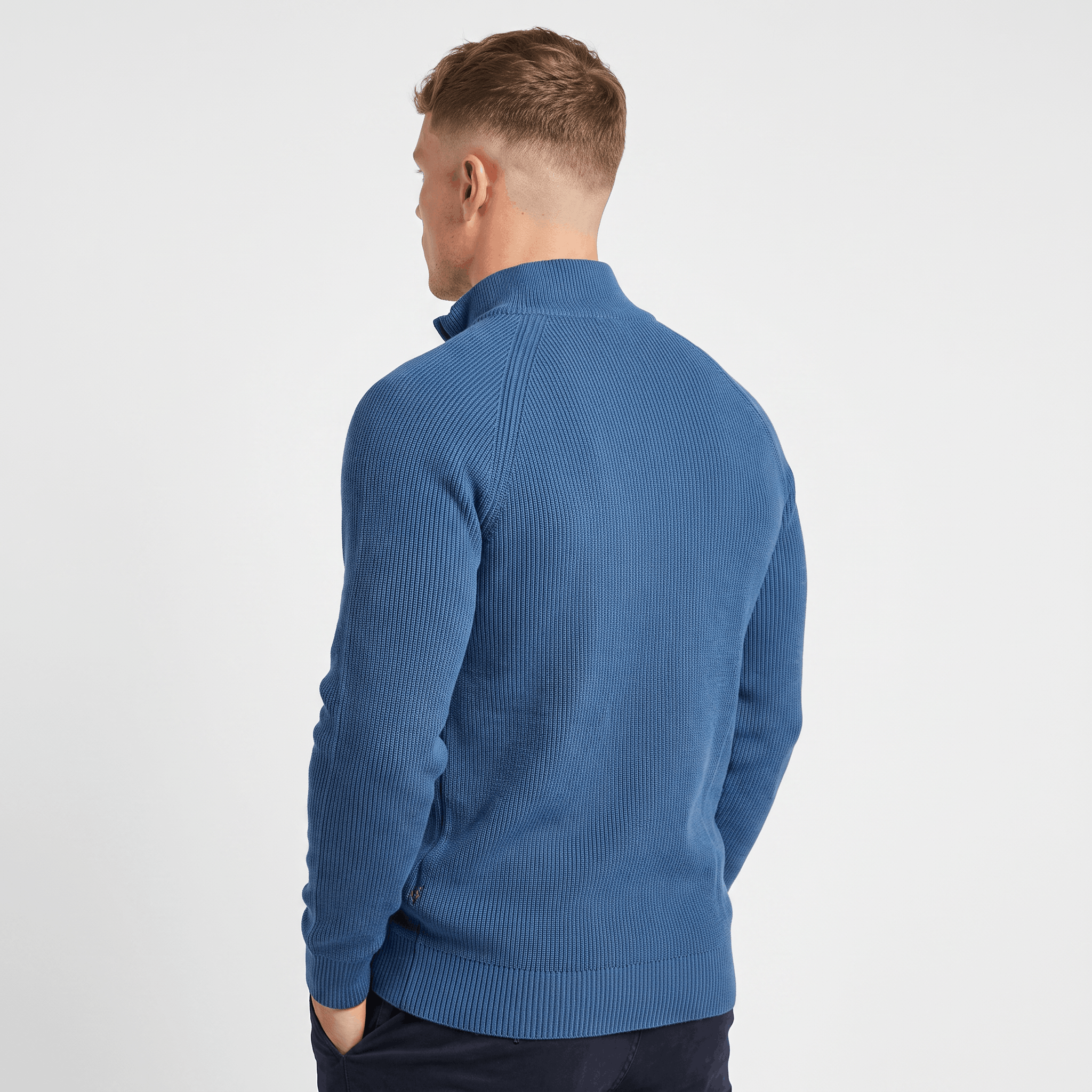 Back view of a men's blue ribbed quarter-zip knit sweater with a stand collar, long sleeves, and a fitted silhouette.