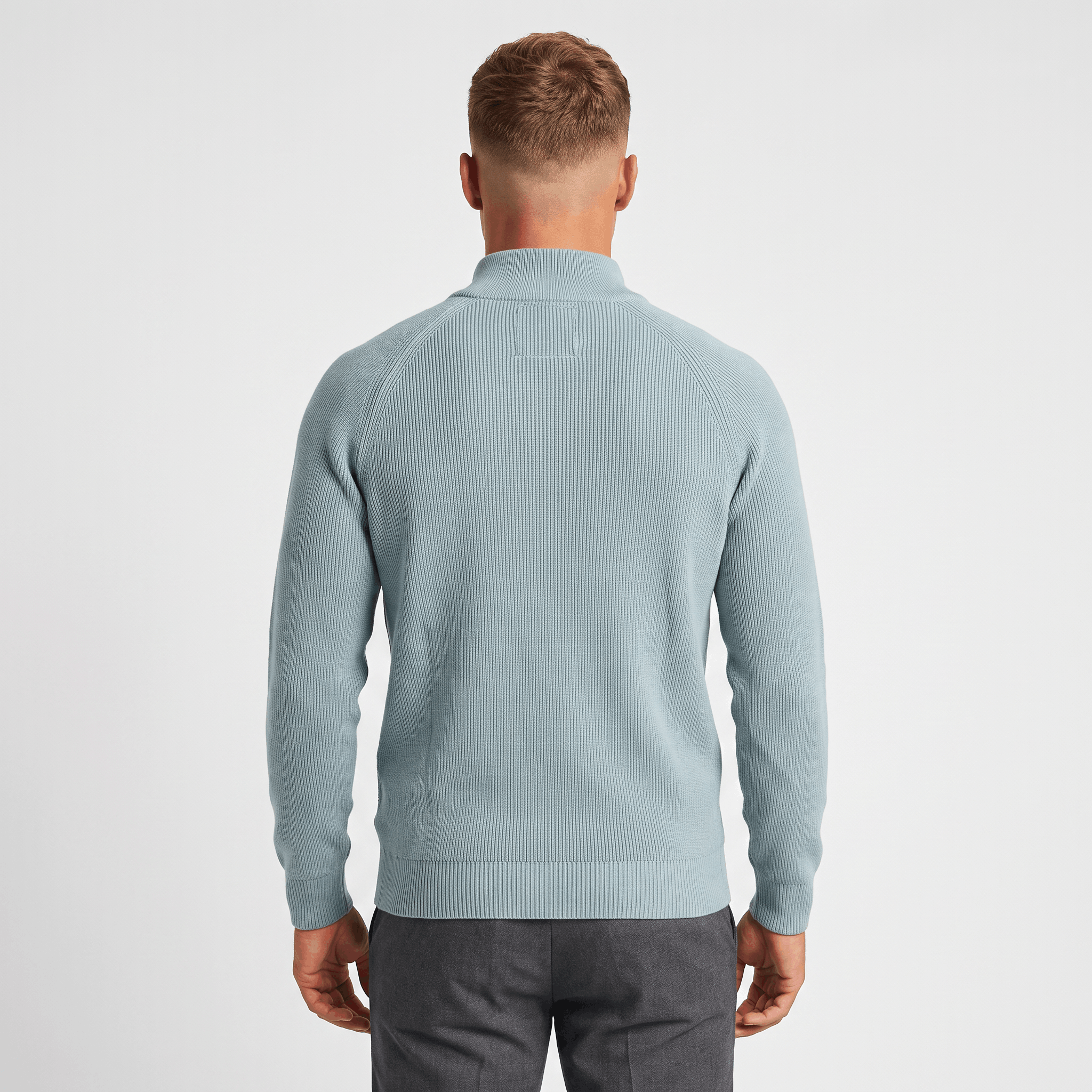 Back view of a men's light blue ribbed quarter-zip knit sweater featuring a stand collar, ribbed texture, and classic fit.
