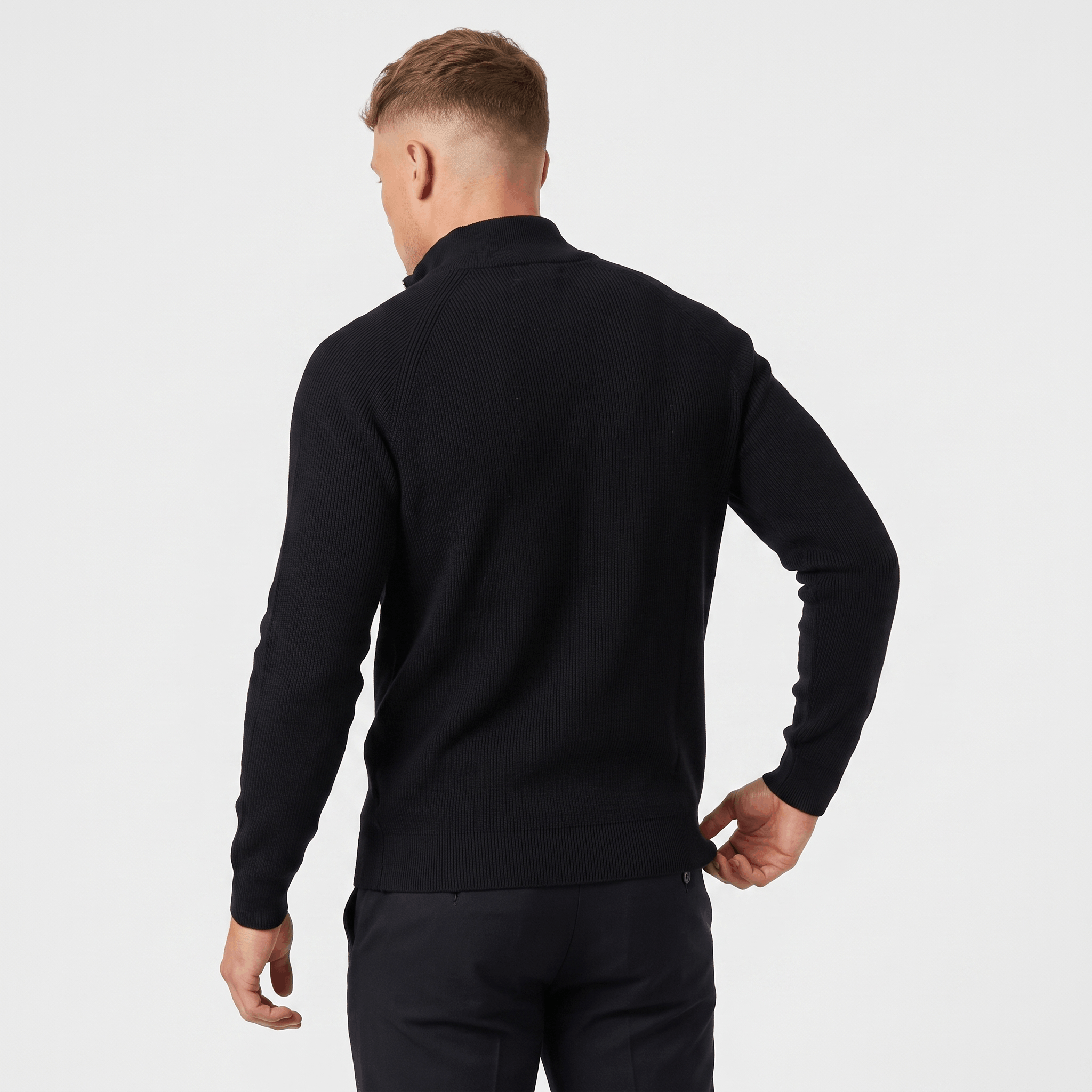 Back view of a men's black ribbed quarter-zip knit sweater with a stand collar and clean minimalist design.