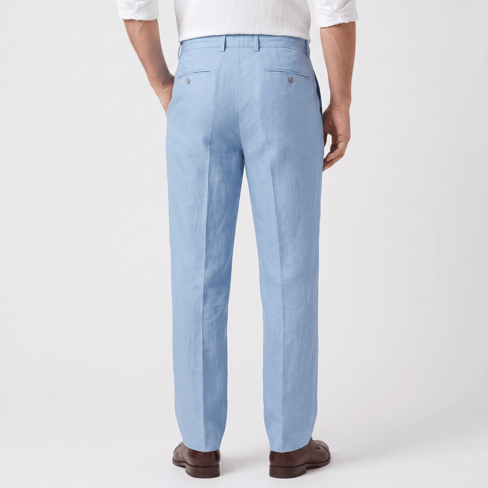 Back view of men's light blue linen drawstring pants with an elastic waistband and relaxed fit.