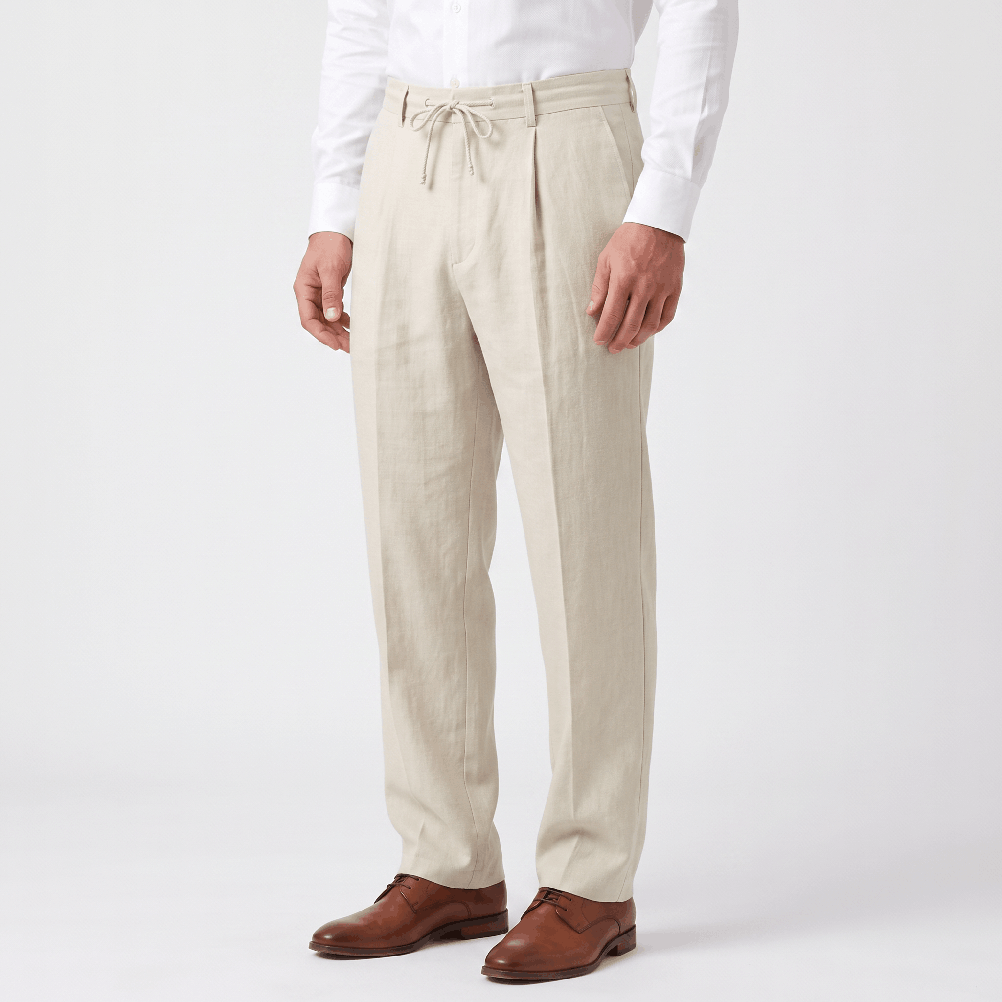 Side view of men's cream linen drawstring pants featuring a lightweight linen construction and relaxed silhouette.