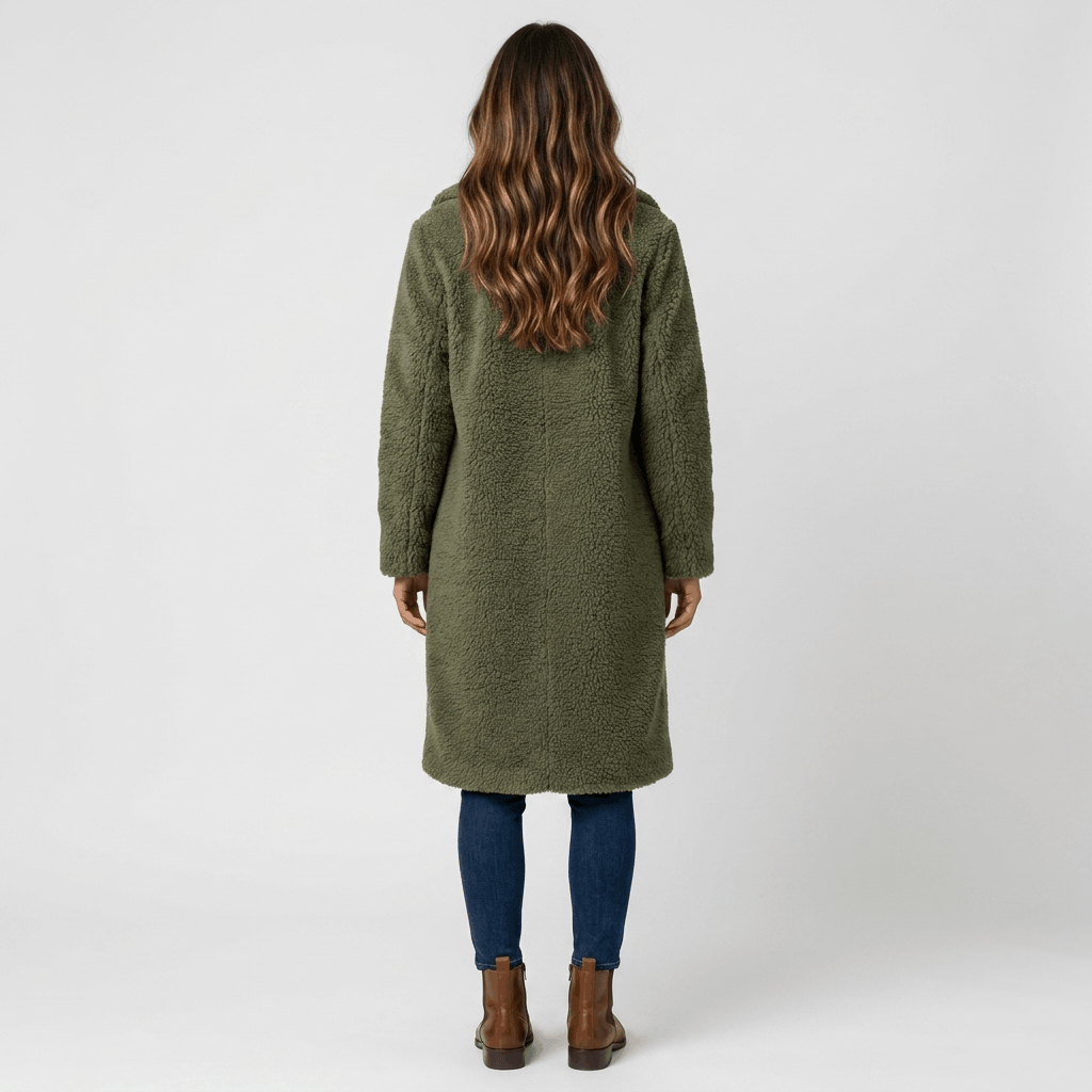 Back view of a woman wearing an olive green long coat with a tailored silhouette and long sleeves.