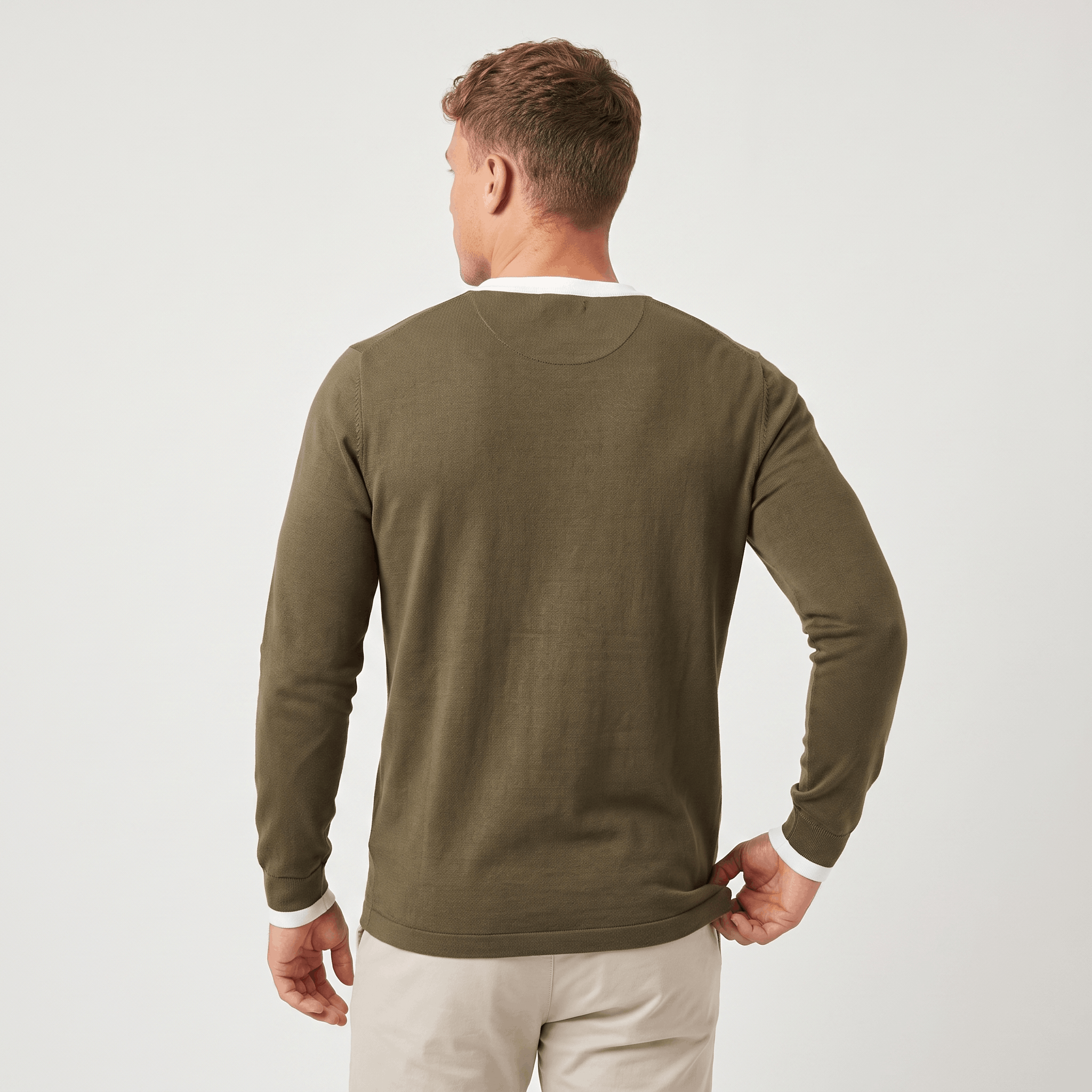 Back view of a men's olive green long-sleeve Henley sweater with long sleeves and a clean minimalist design.