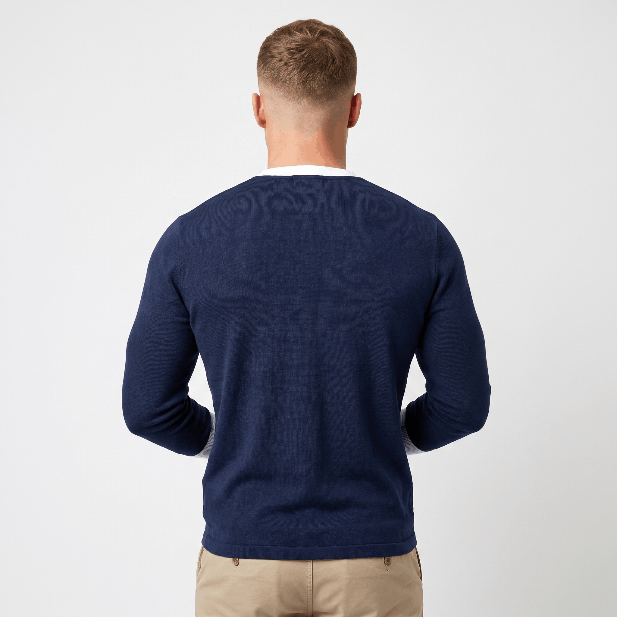 Back view of a men's blue long-sleeve Henley sweater with a clean silhouette and ribbed hem.