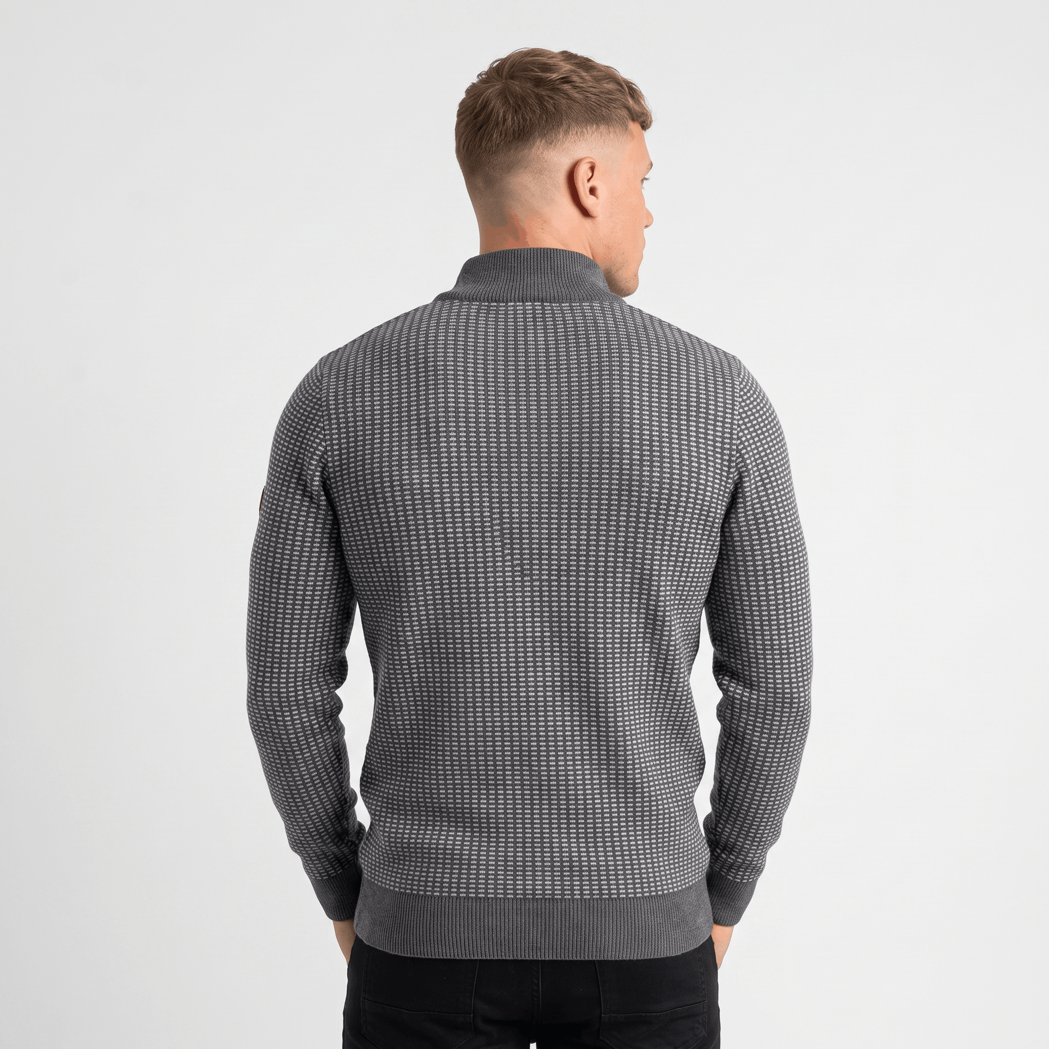 Back view of a men's gray textured quarter-zip knit sweater with a stand collar and all-over textured pattern.