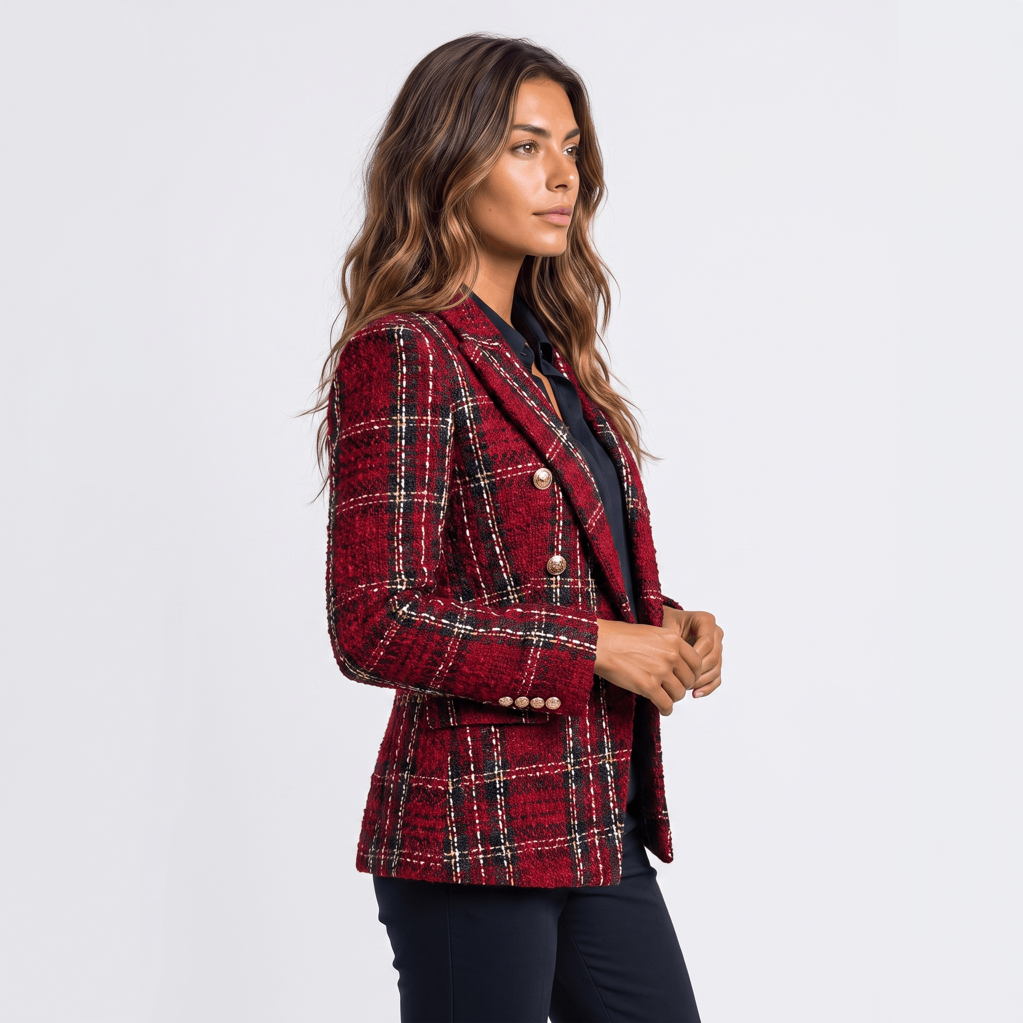 Side view of a woman wearing a red plaid tweed blazer with a tailored fit, notched lapels, and gold-tone buttons.