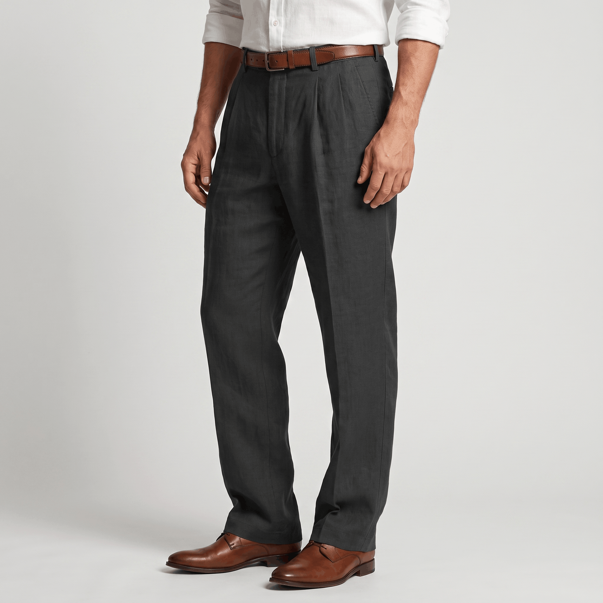 Side view of men's charcoal linen pleated trousers featuring a tailored fit and breathable linen construction.