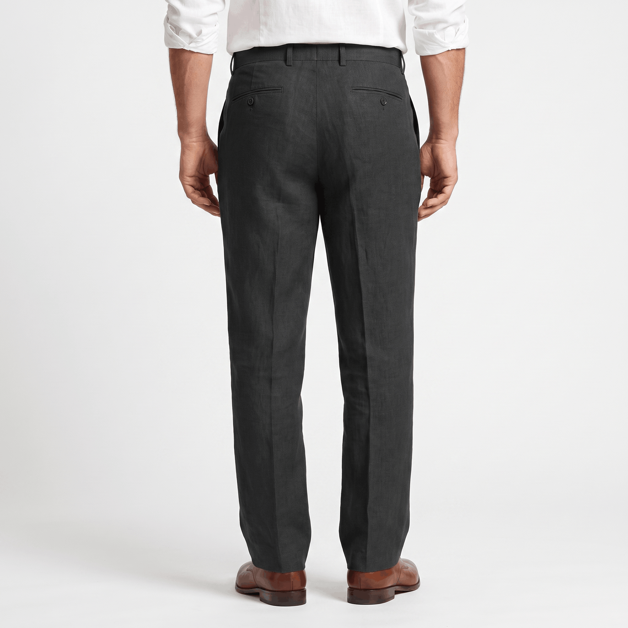 Back view of men's charcoal linen pleated trousers with a straight-leg silhouette, front pleats, and belt loops.