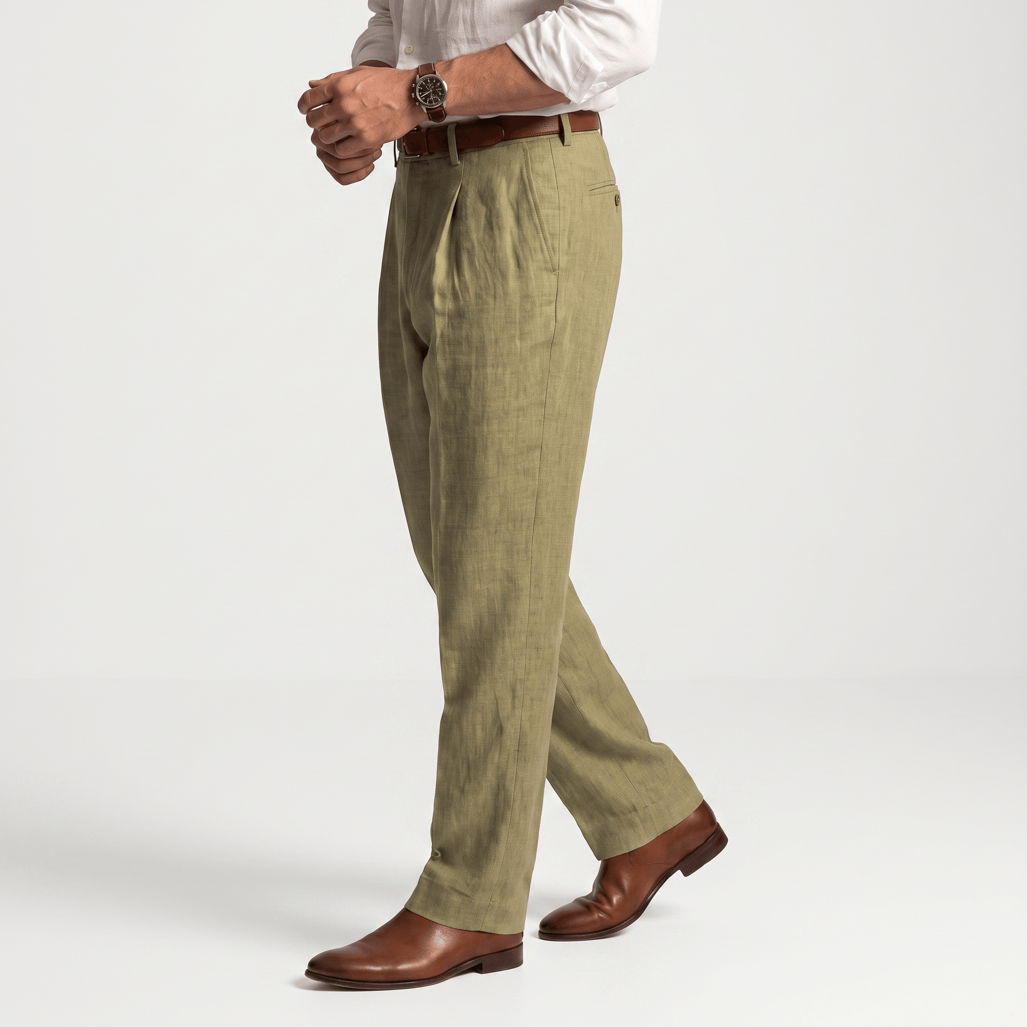 Side view of men's olive green linen pleated trousers featuring a tailored silhouette and lightweight linen fabric.