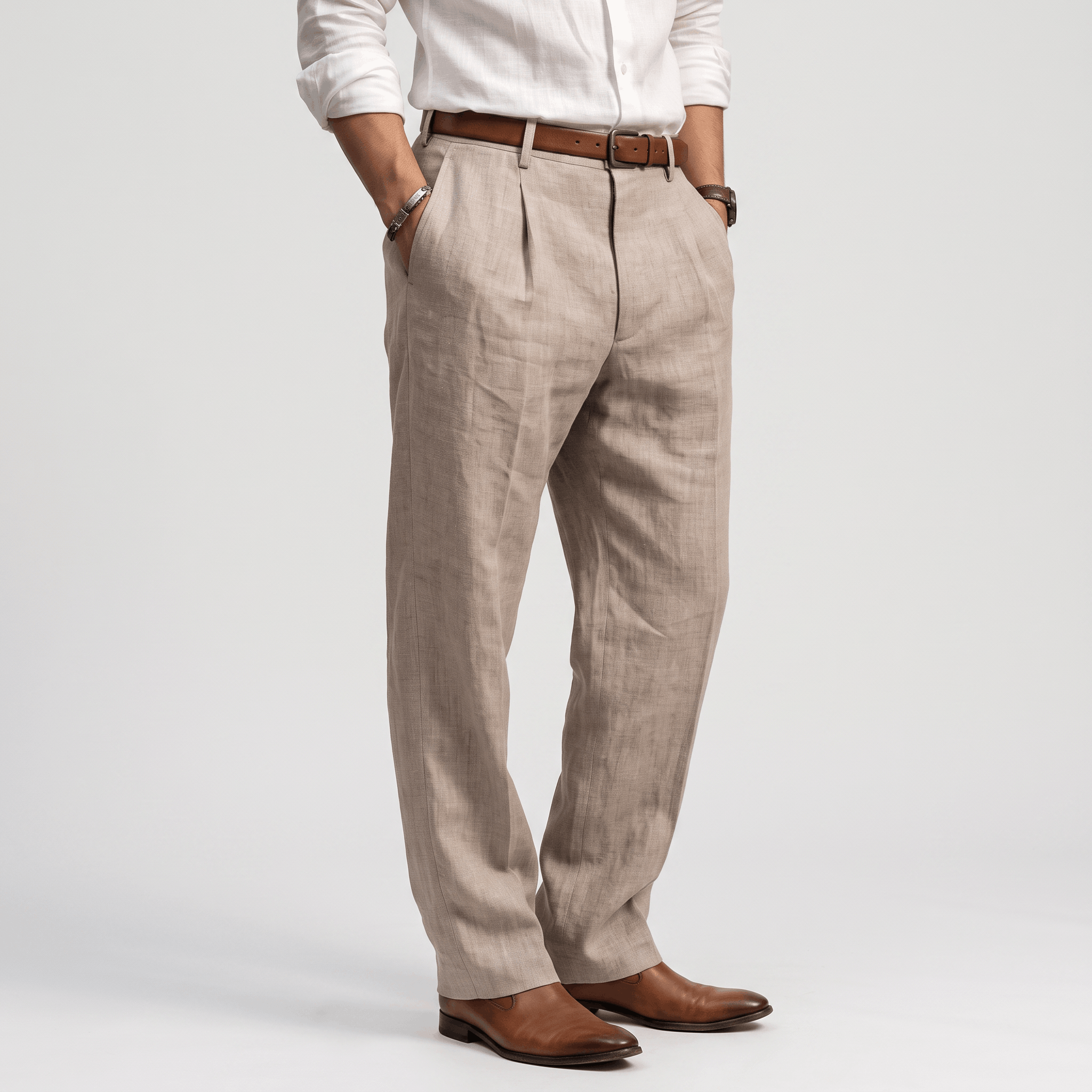 Side view of men's beige linen pleated trousers featuring a straight-leg fit, front pleats, and lightweight linen fabric.