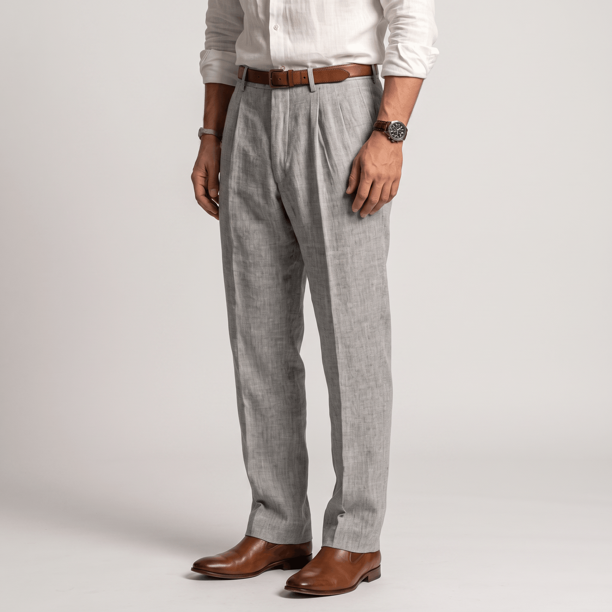 Side view of men's light gray linen pleated trousers featuring a tailored straight-leg silhouette and breathable linen fabric.