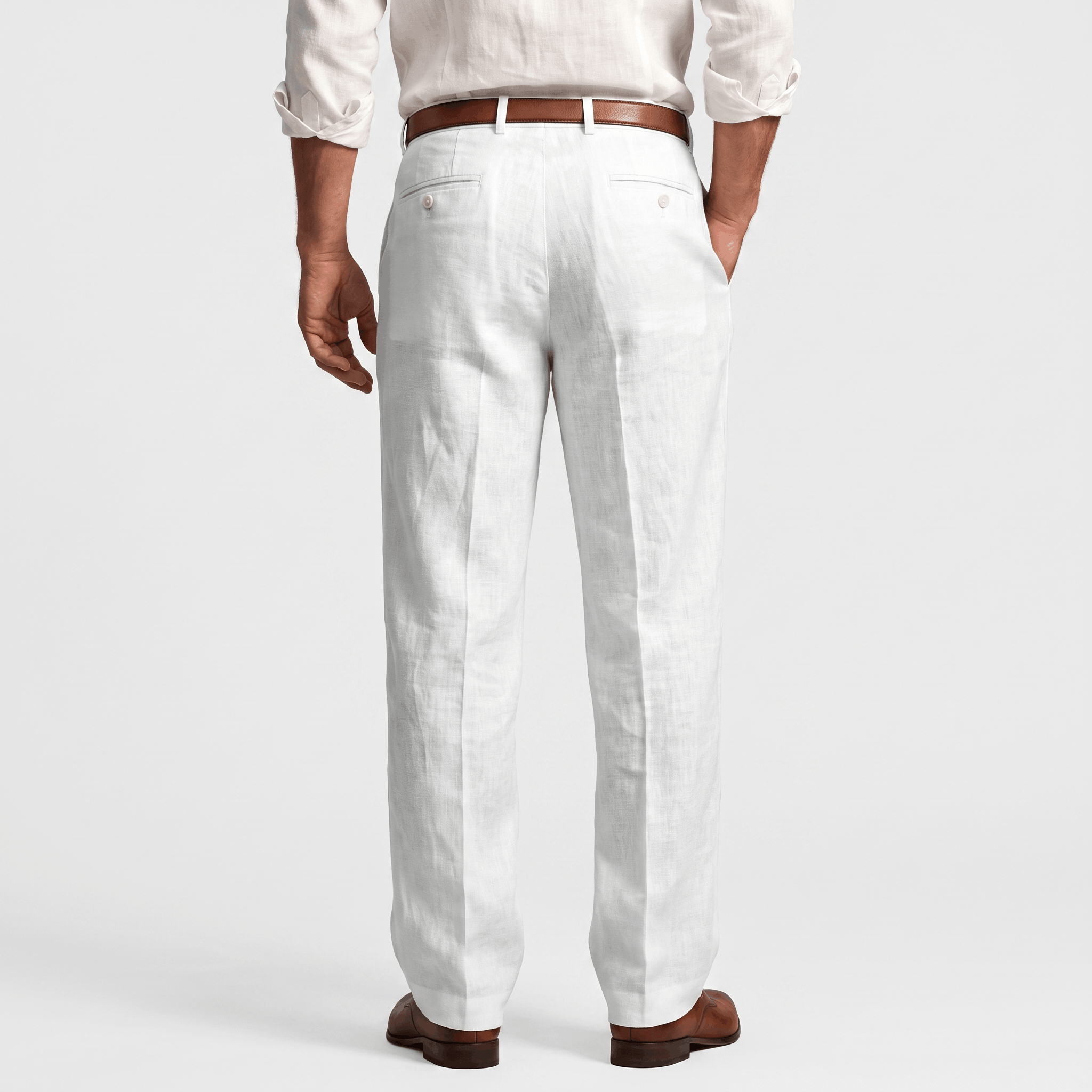 Back view of men's white linen pleated trousers with belt loops, front pleats, and a relaxed tailored fit.
