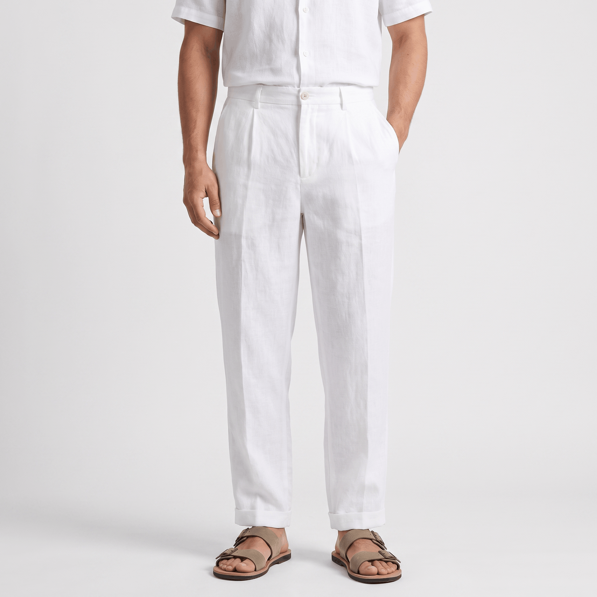 Men's white linen pants featuring a straight-leg fit, button closure, belt loops, and side pockets.
