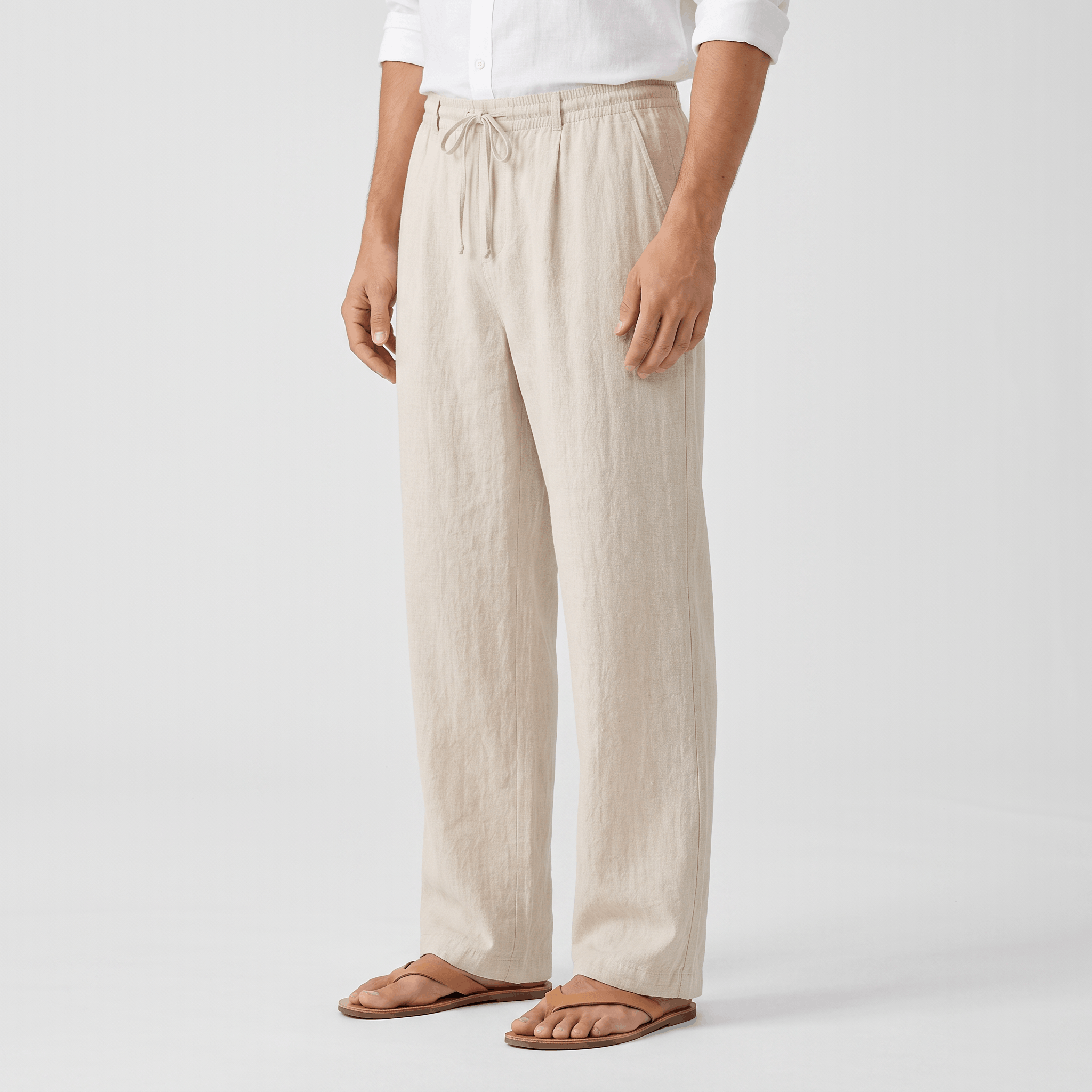 Side view of men's cream linen drawstring pants featuring a relaxed fit, adjustable drawstring, and breathable linen fabric.