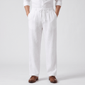 Men's white linen drawstring pants with a relaxed straight-leg fit, elastic waistband, adjustable drawstring, and side pockets.