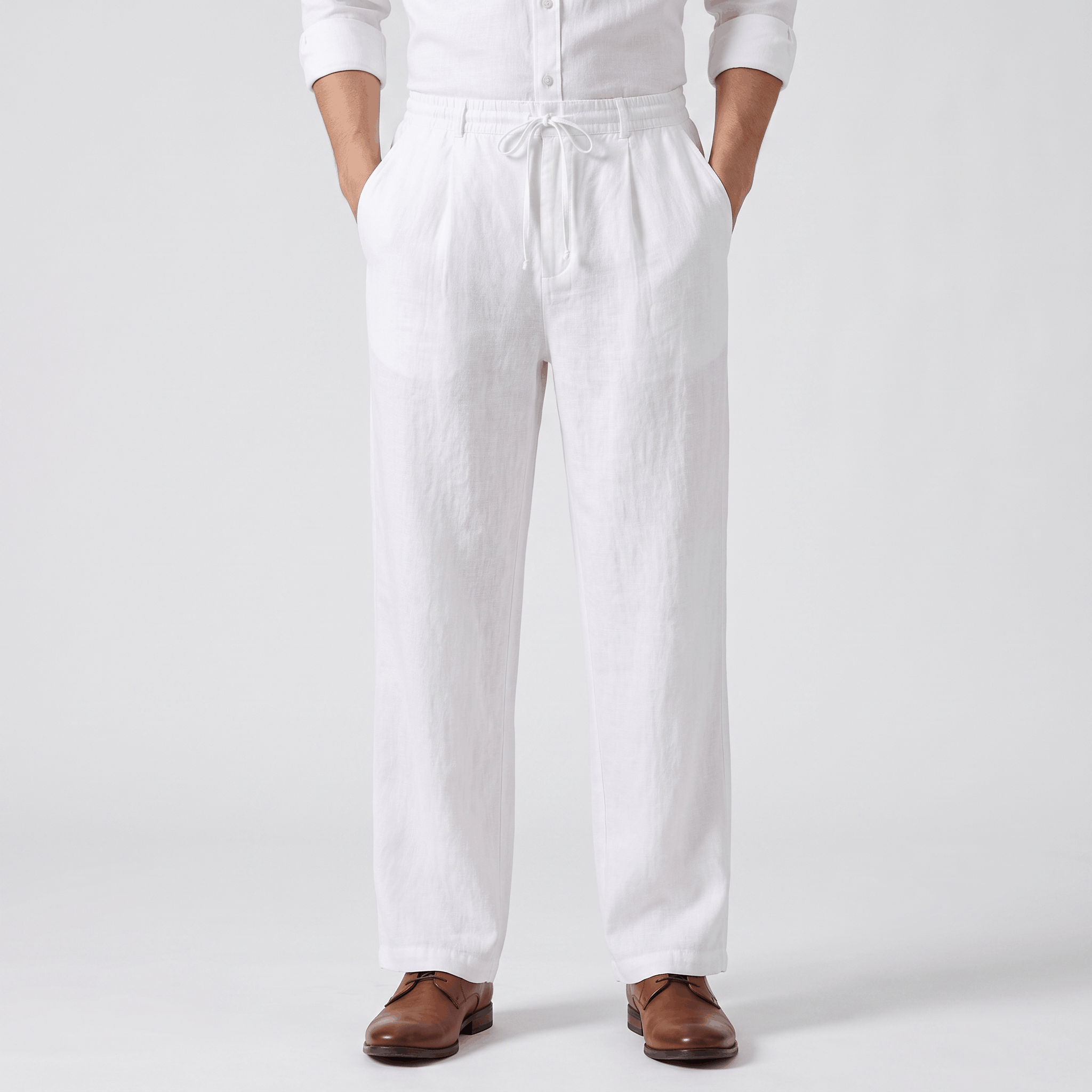 Men's white linen drawstring pants with a relaxed straight-leg fit, elastic waistband, adjustable drawstring, and side pockets.
