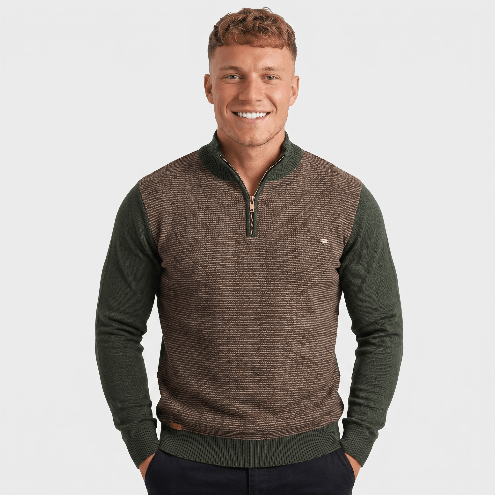 Man wearing a brown and olive green color block quarter-zip knit sweater with a stand collar and ribbed texture.
