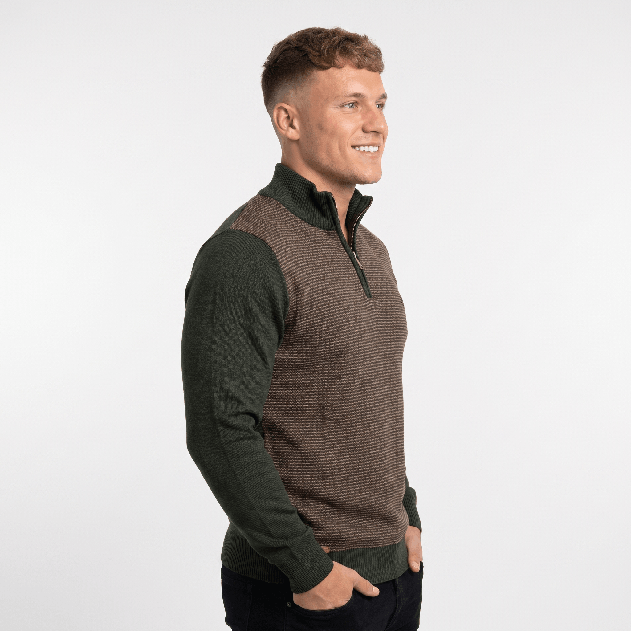 Side view of a man wearing a brown and olive green quarter-zip sweater with ribbed knit construction and stand collar.