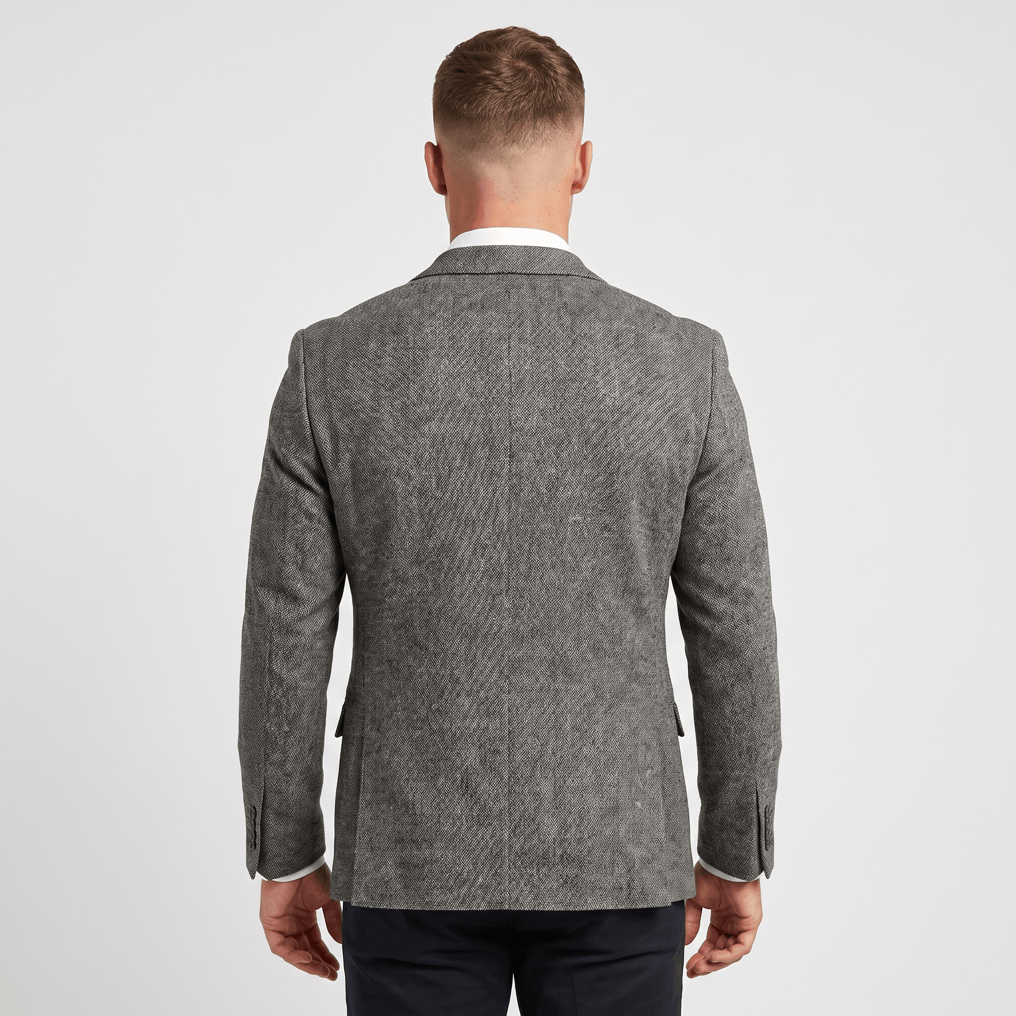 Back view of a men's gray tweed blazer featuring a clean tailored fit and classic blazer construction.