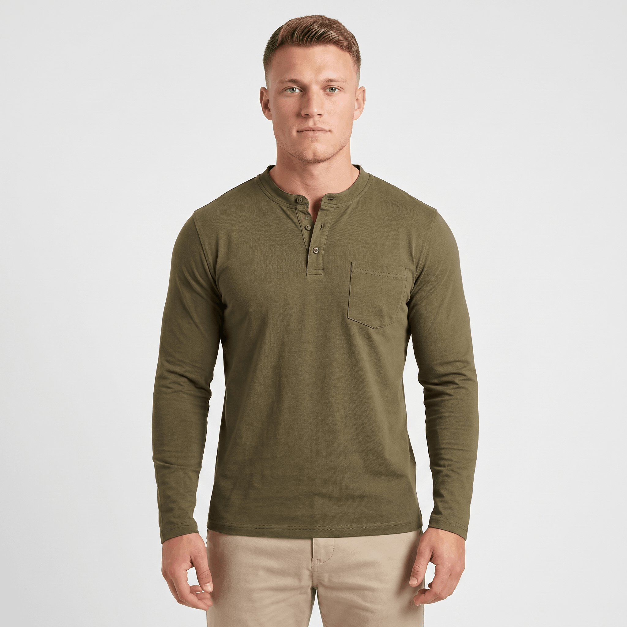 Man wearing an olive green long-sleeve Henley shirt with a three-button placket, chest pocket, and modern slim fit.