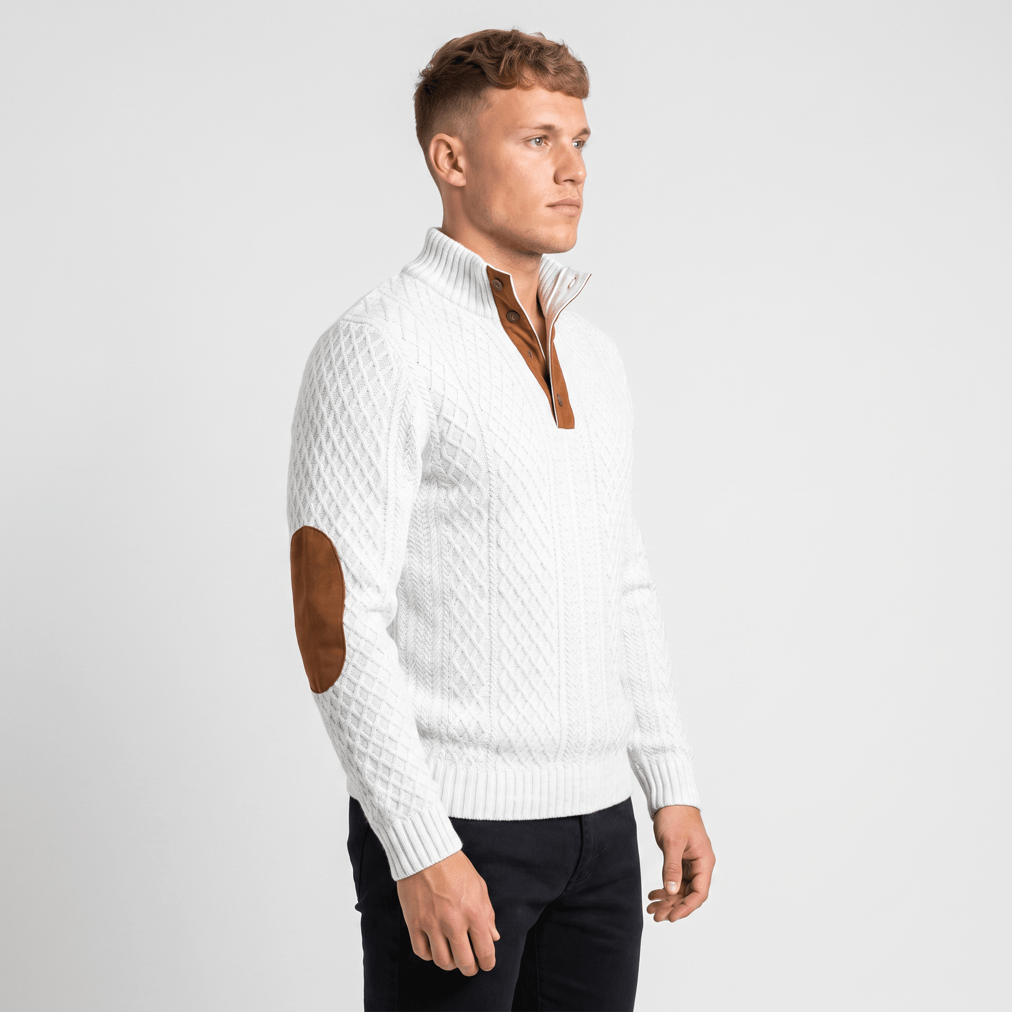 Side view of a man wearing a white cable knit Henley sweater featuring a textured knit pattern and elbow patch details.