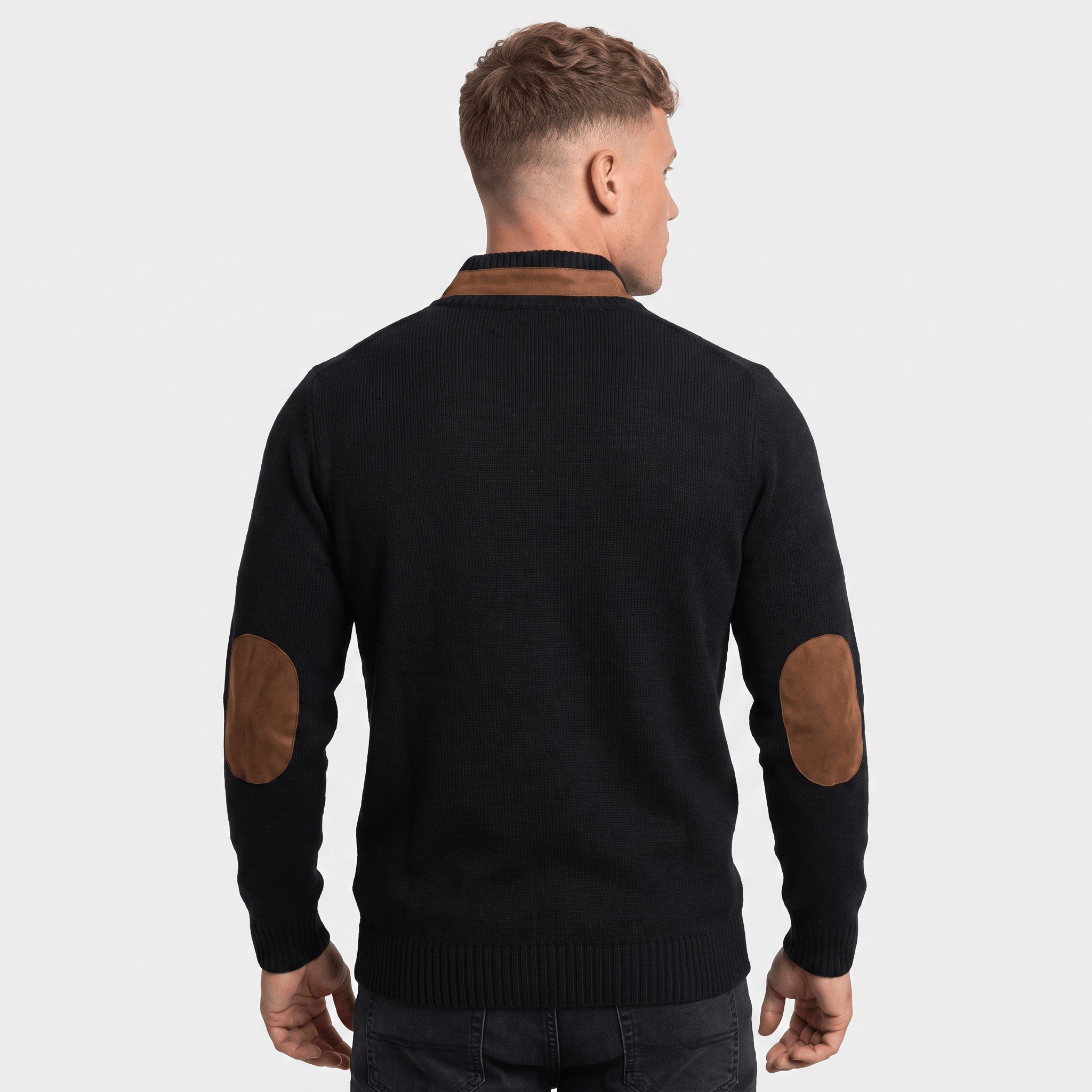 Back view of a men's black cable knit Henley sweater with faux suede elbow patches, ribbed trim, and long sleeves.
