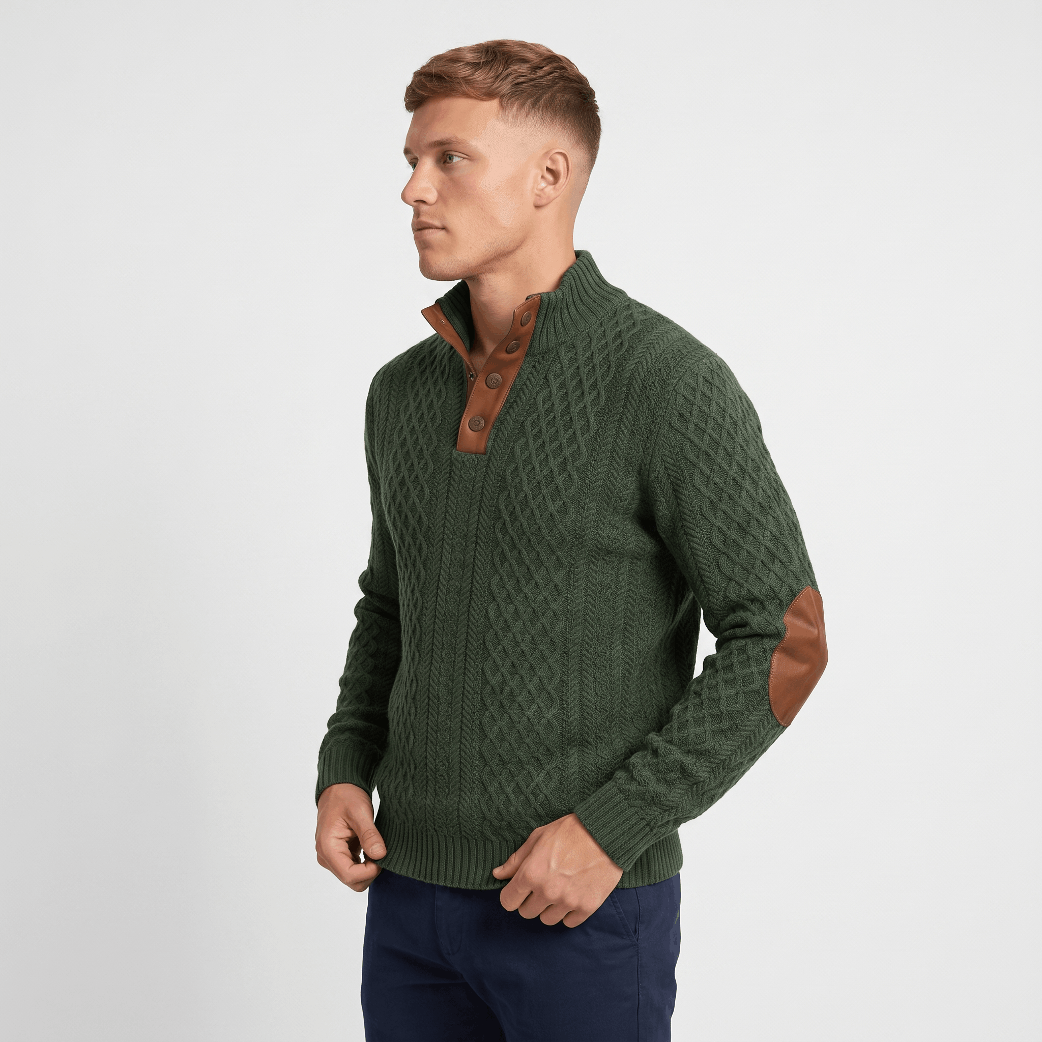 Side view of a man wearing a green cable knit Henley sweater with a textured knit pattern and elbow patches.