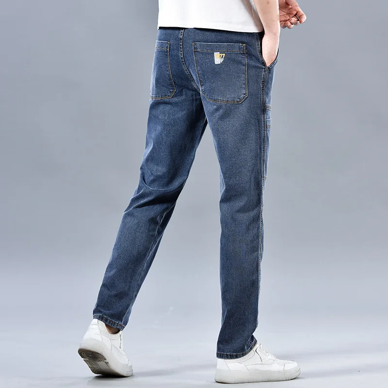 Logan Denim Cargo Pants – Stretch Utility Jeans with Multi-Pocket Design & Tapered Fit